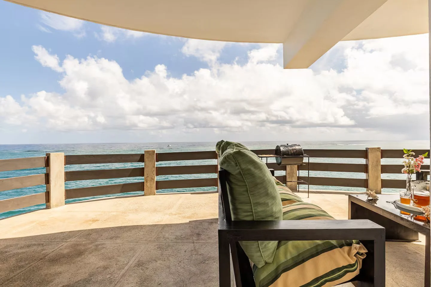 Oceanfront Terrace with seating overlooking the Caribbean Sea.