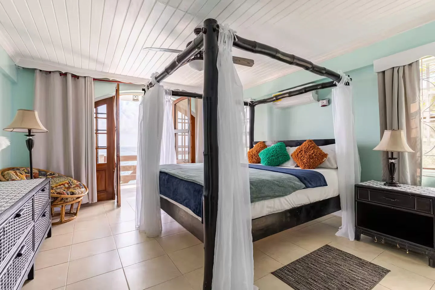 Luxury Master bedroom with four poster Bed and Oceanfront Terrace.