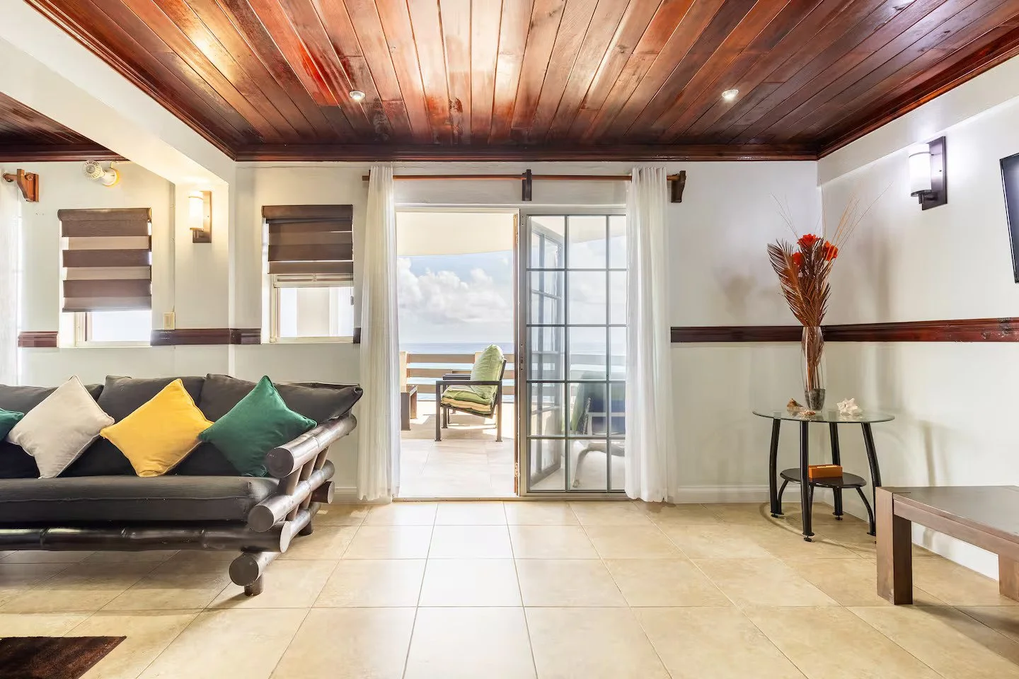 Lounge chairs on waterfront deck at Caribbean sunset.