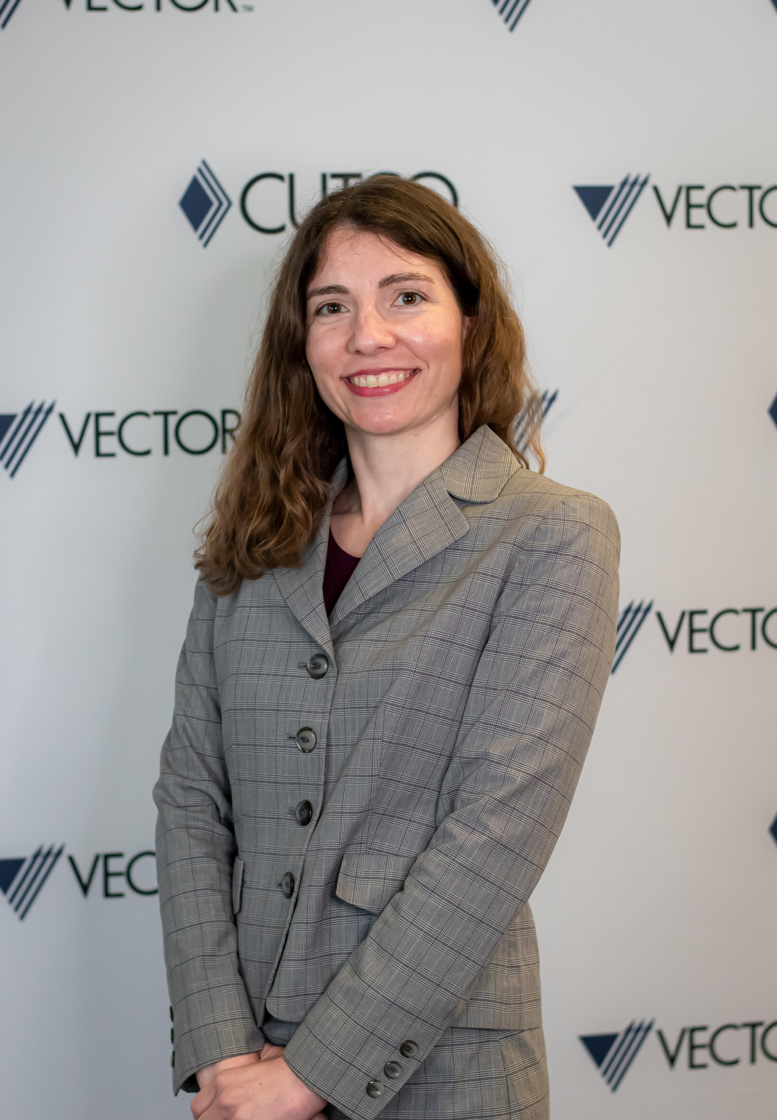 smiling young brunette woman in a business suit