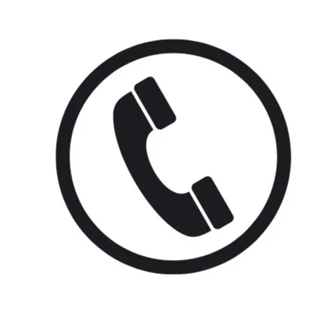Icon of a telephone handset inside a circle, indicating phone or call action.