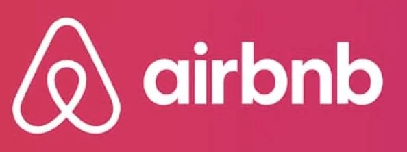 Airbnb logo with pink background and white logo and text.
