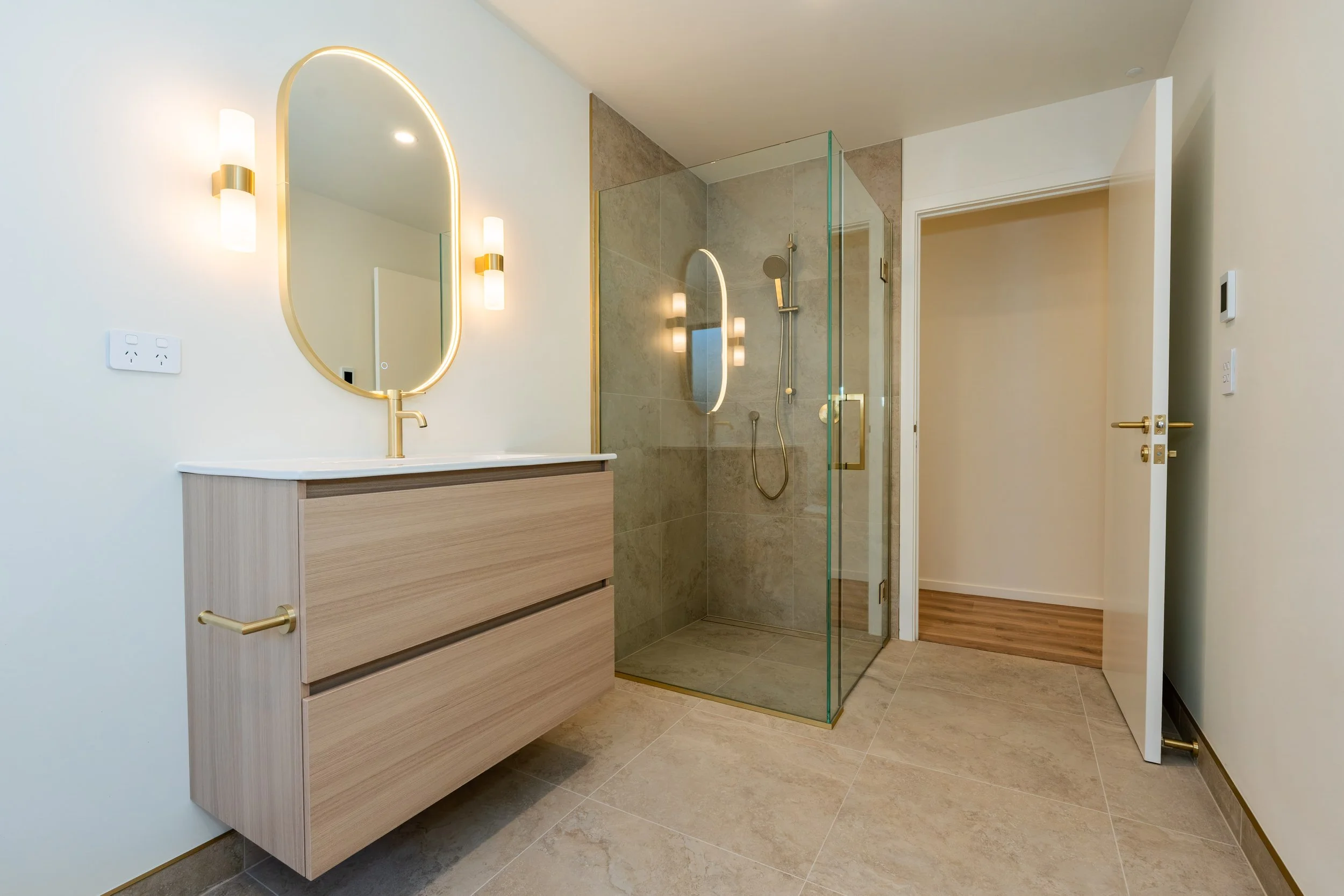 Designer family bathroom featuring premium materials, custom cabinetry, and contemporary finishes, creating a sophisticated and functional space for modern living.
