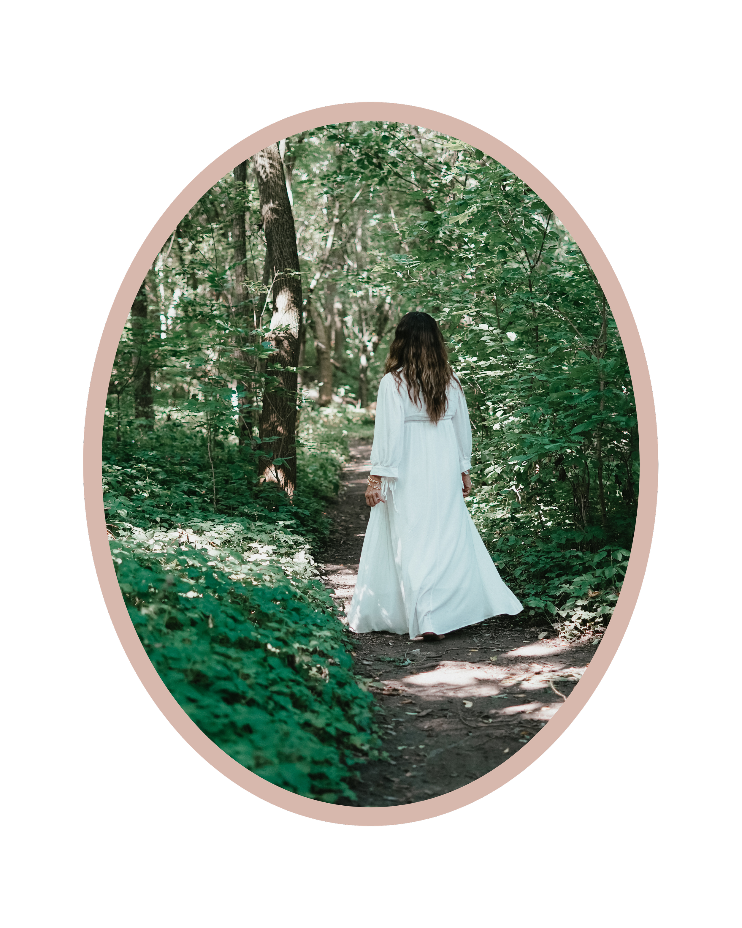 A woman in a long white dress walking on a dirt path through a dense green forest. . Experiencing healing through somatic coaching.