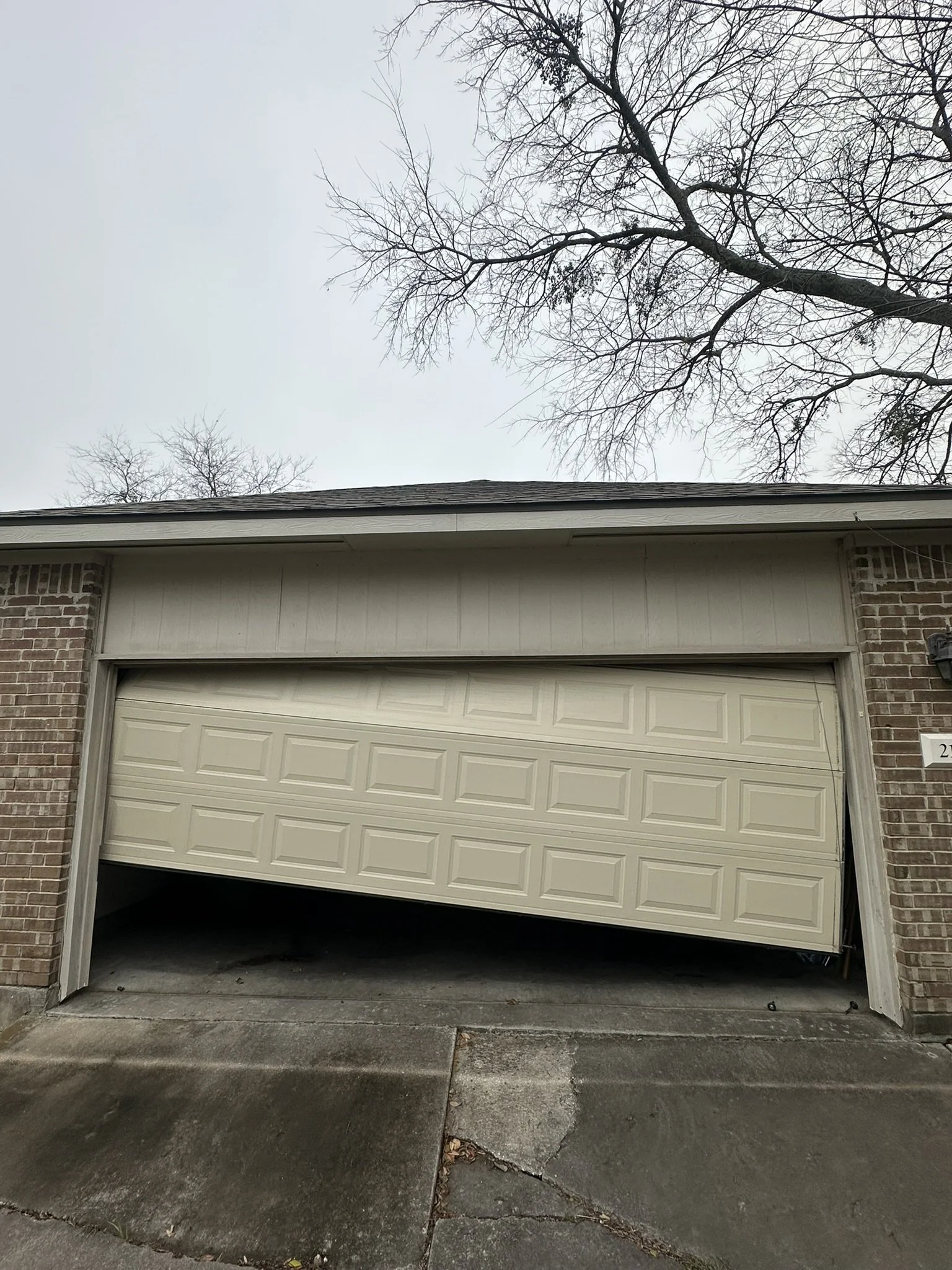 A garage door that has come off the track and needed a door reset by one of our local technicians here in Austin, Texas. This one was able to be repaired rather than an outright replacement!
