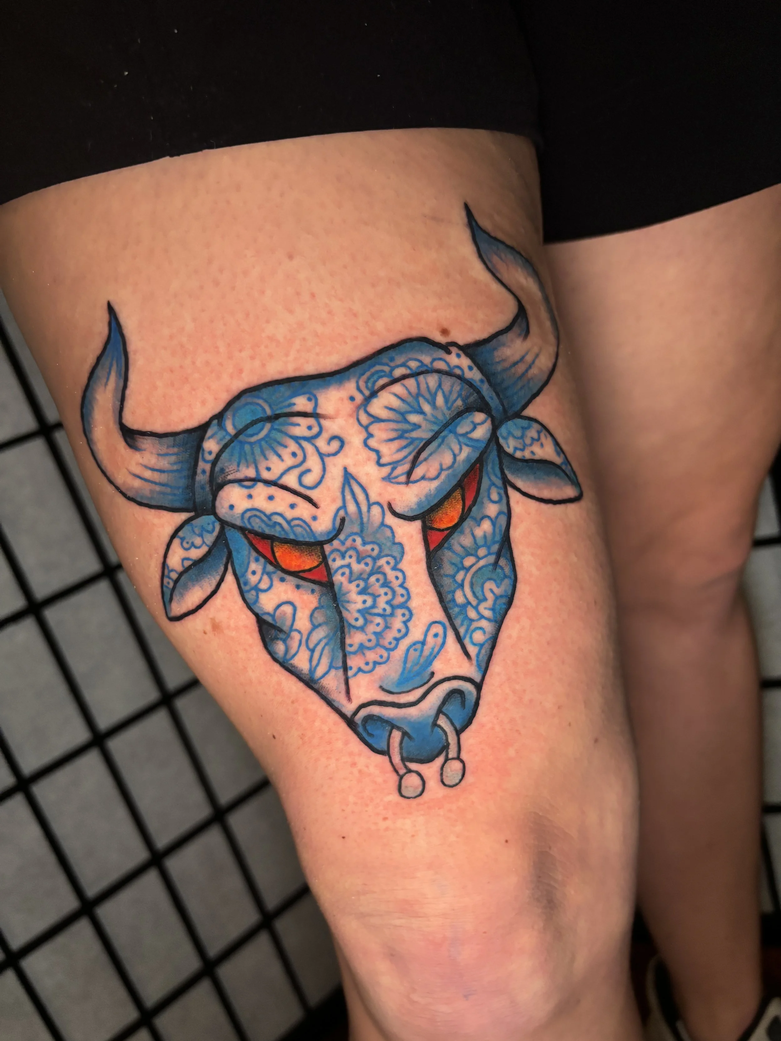 Colorful Tattoo of a Bull done in American traditional style at Stag and Castle Tattoo shop in Cincinnati Ohio