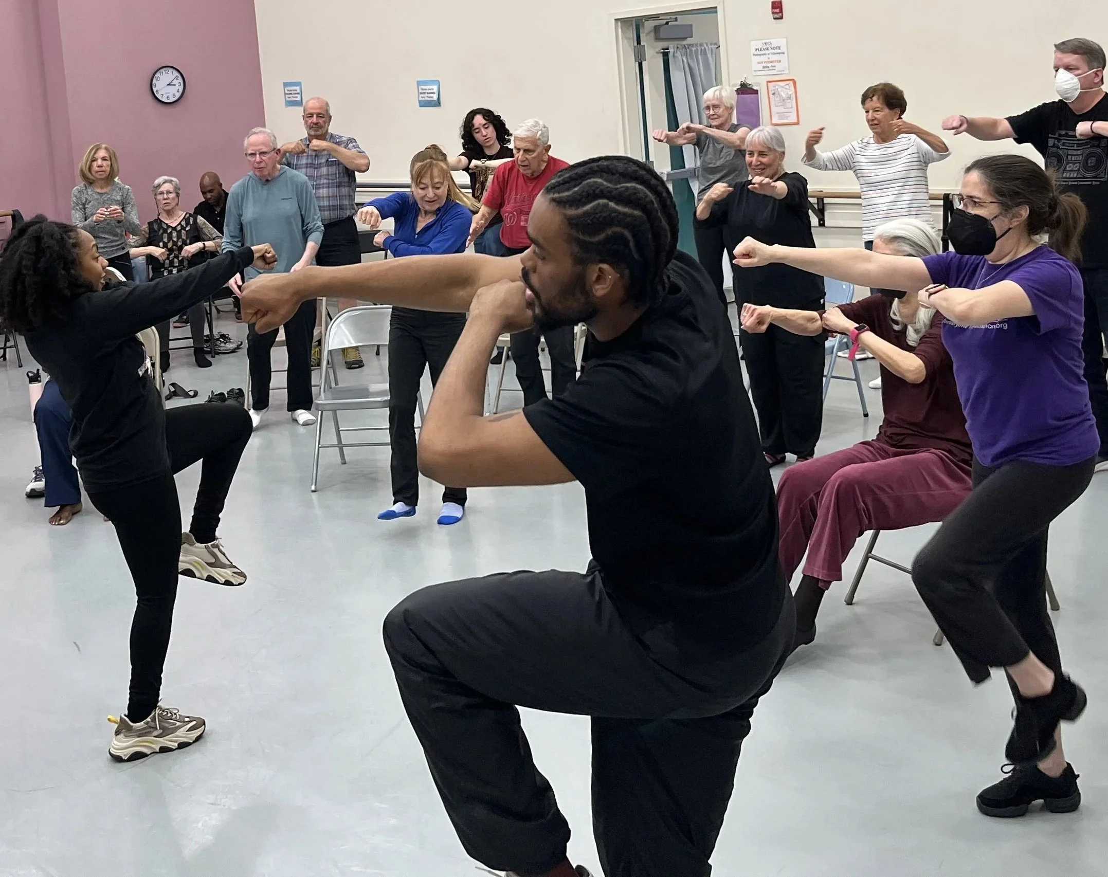 People participating in a Dance for PD class at Maryland Youth Ballet, led by dancers from Step Afrika!