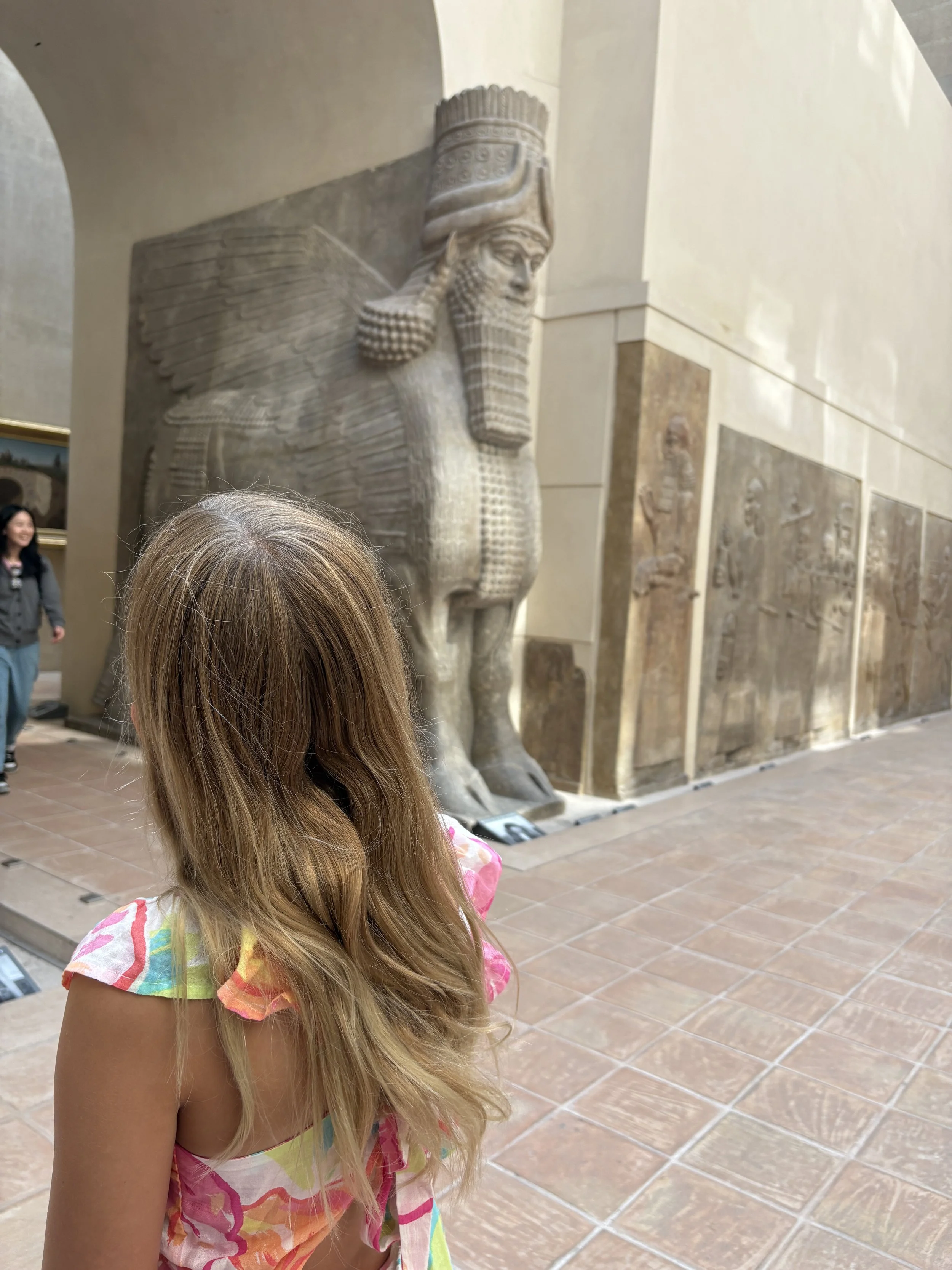 our family using points and miles to travel to Paris and visit the Louvre