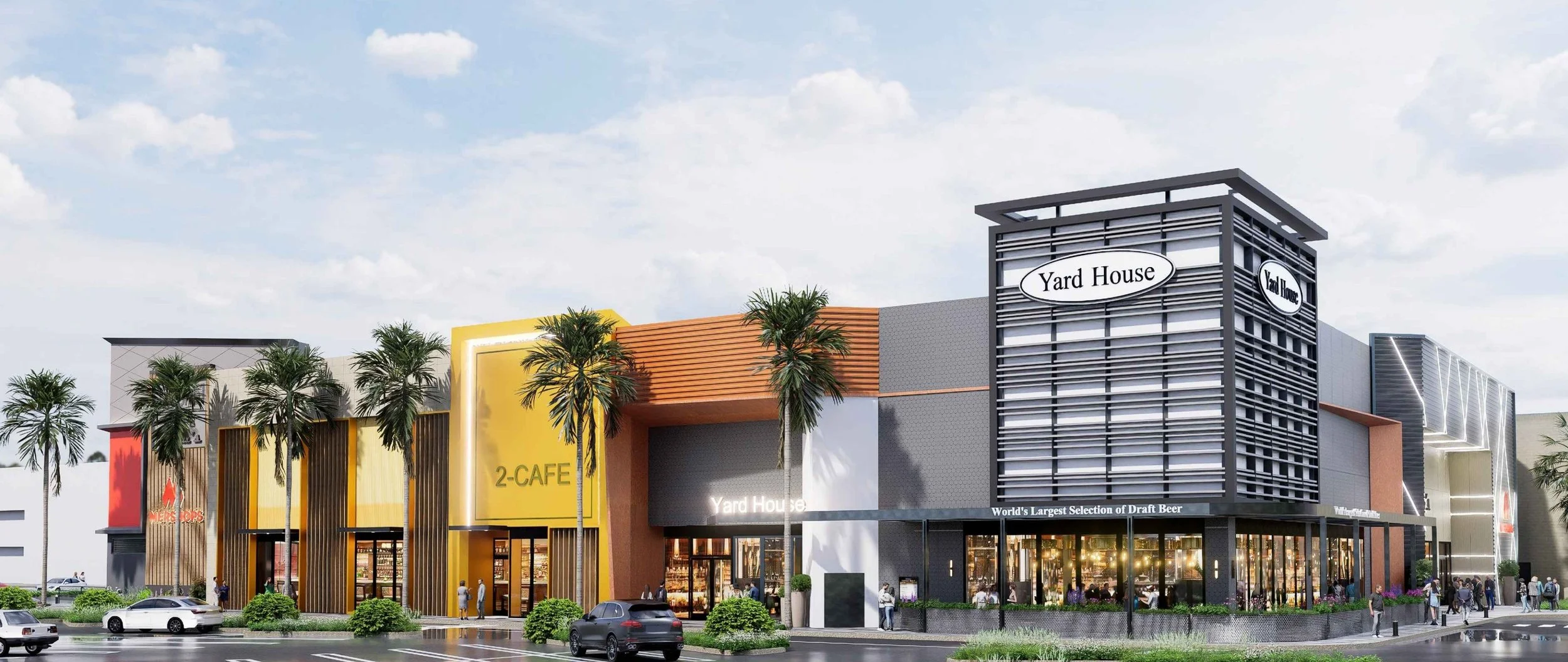 A modern shopping complex with various stores and palm trees, including a Yard House restaurant, a cafe, and other retail stores under a partly cloudy sky. Structural engineering by BASE Design in San Francisco.