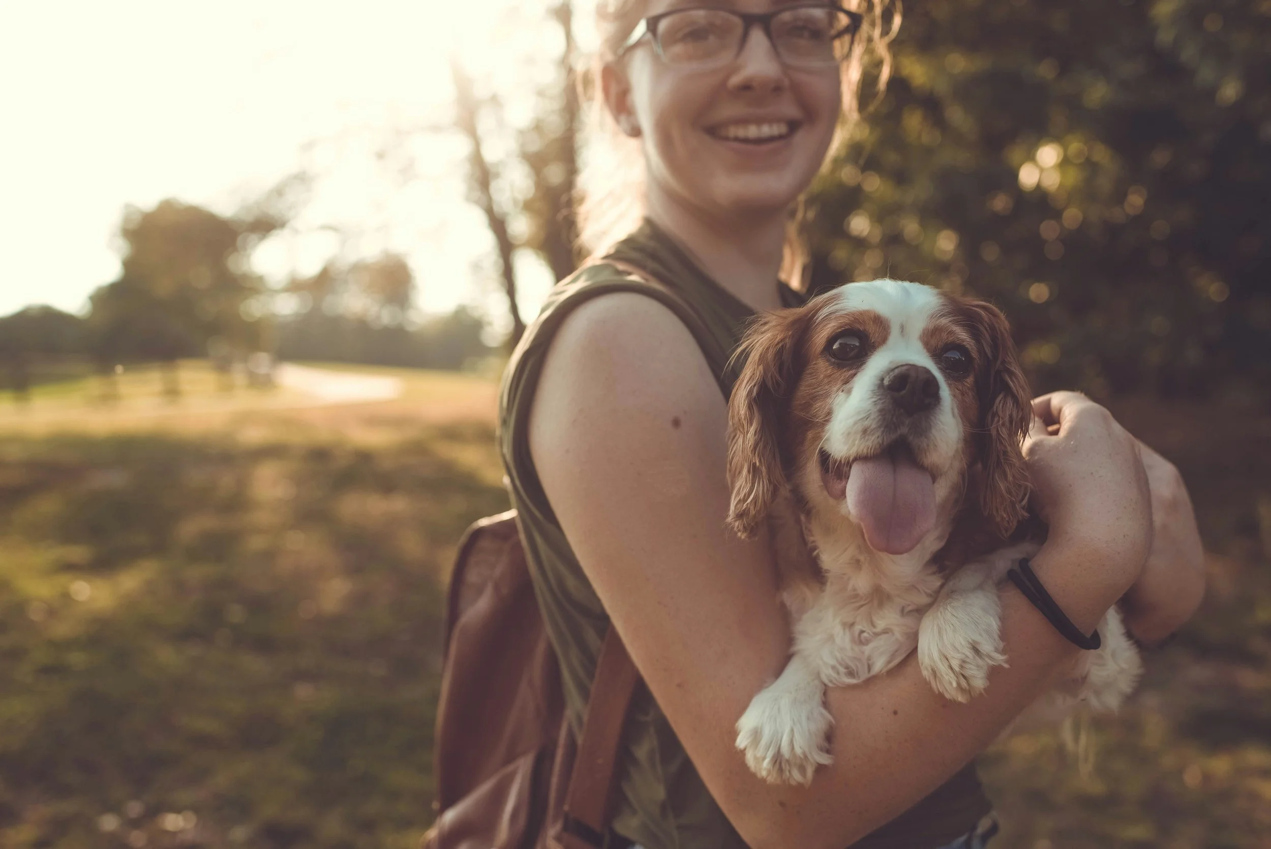 woman holding dog