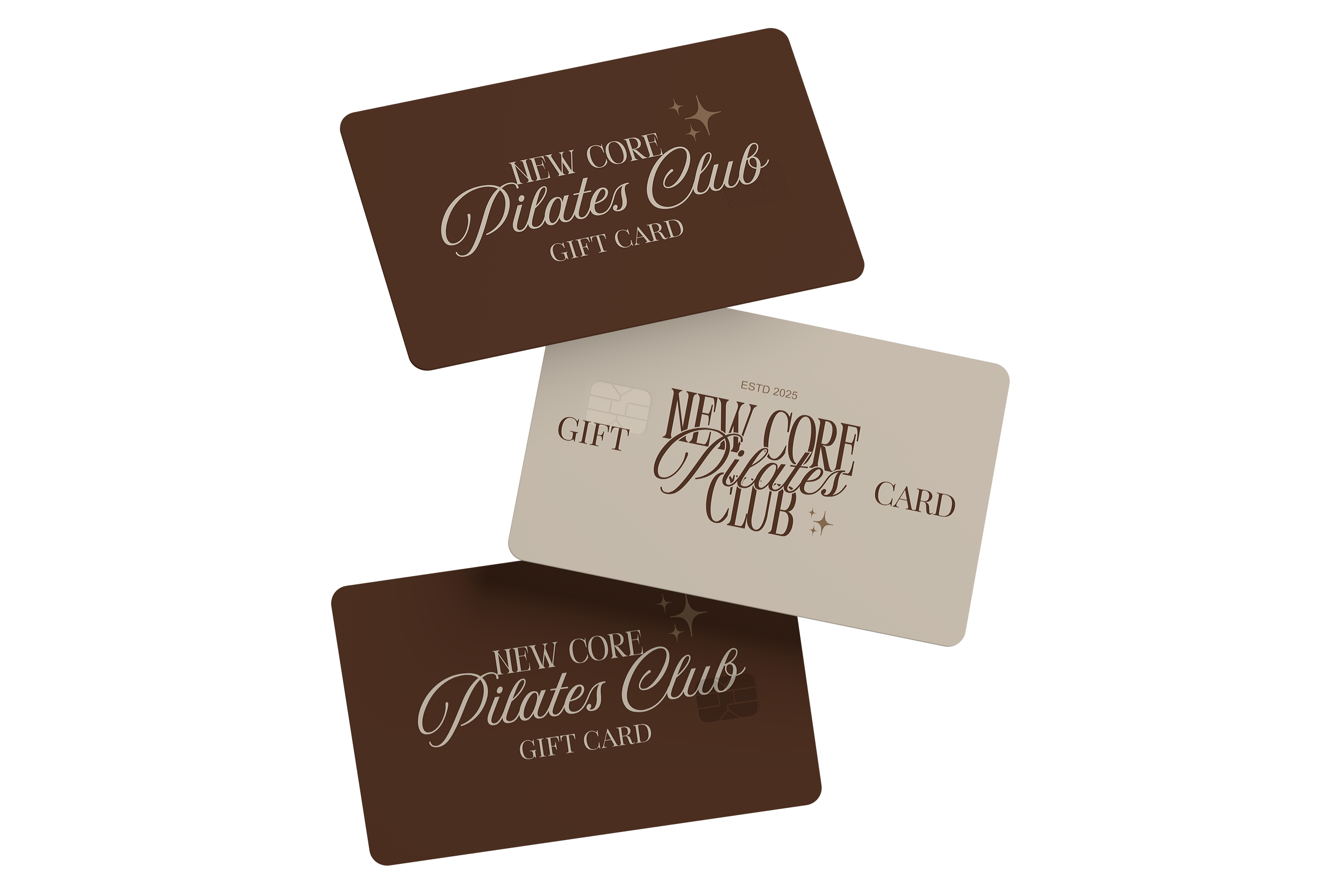 Three gift cards for New Core Pilates Club, with two brown cards and one beige card, positioned overlapping each other.
