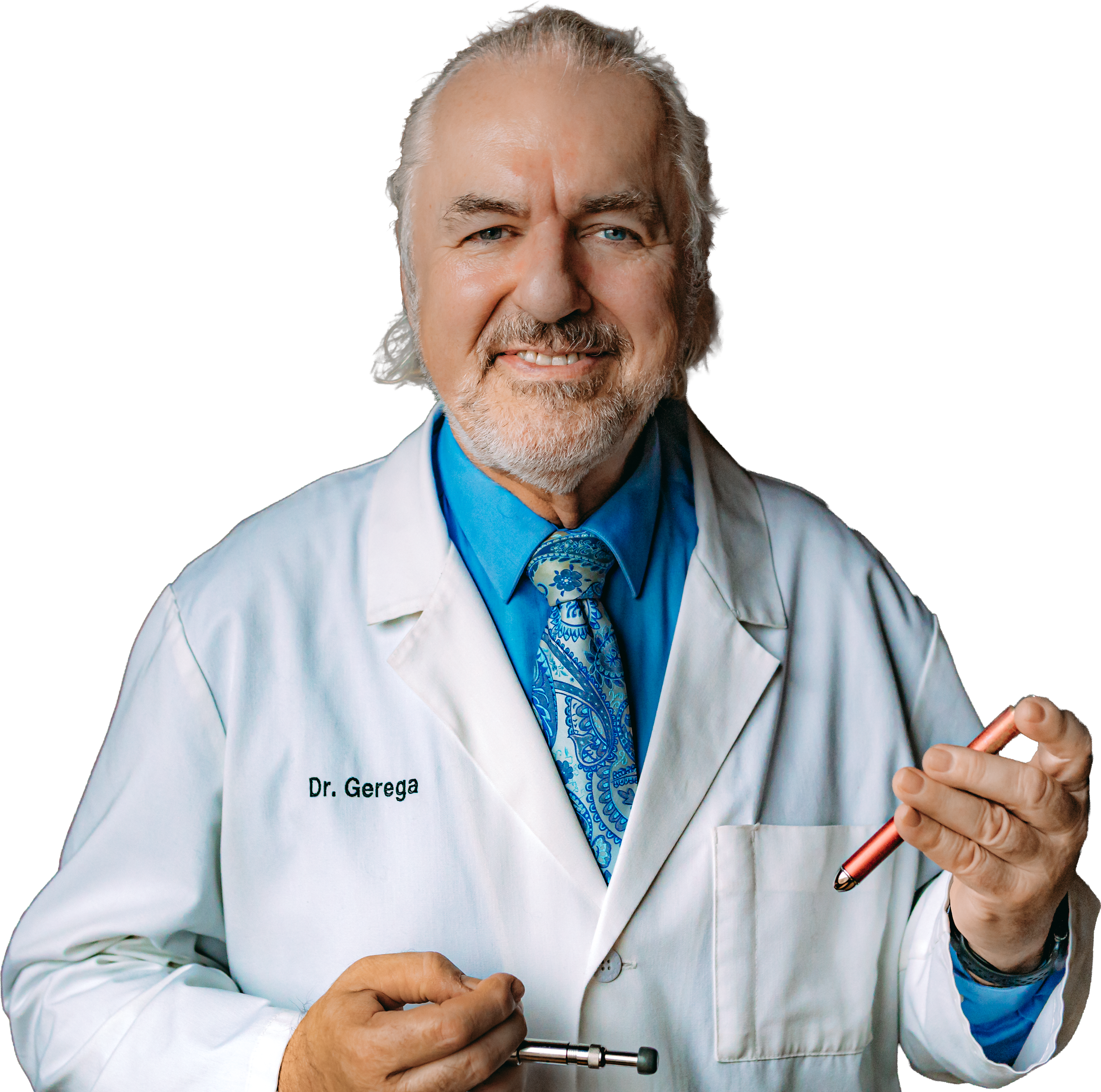 A senior male doctor with gray hair and beard wearing a white coat, blue shirt, and tie, holding a stethoscope and smiling at the camera.