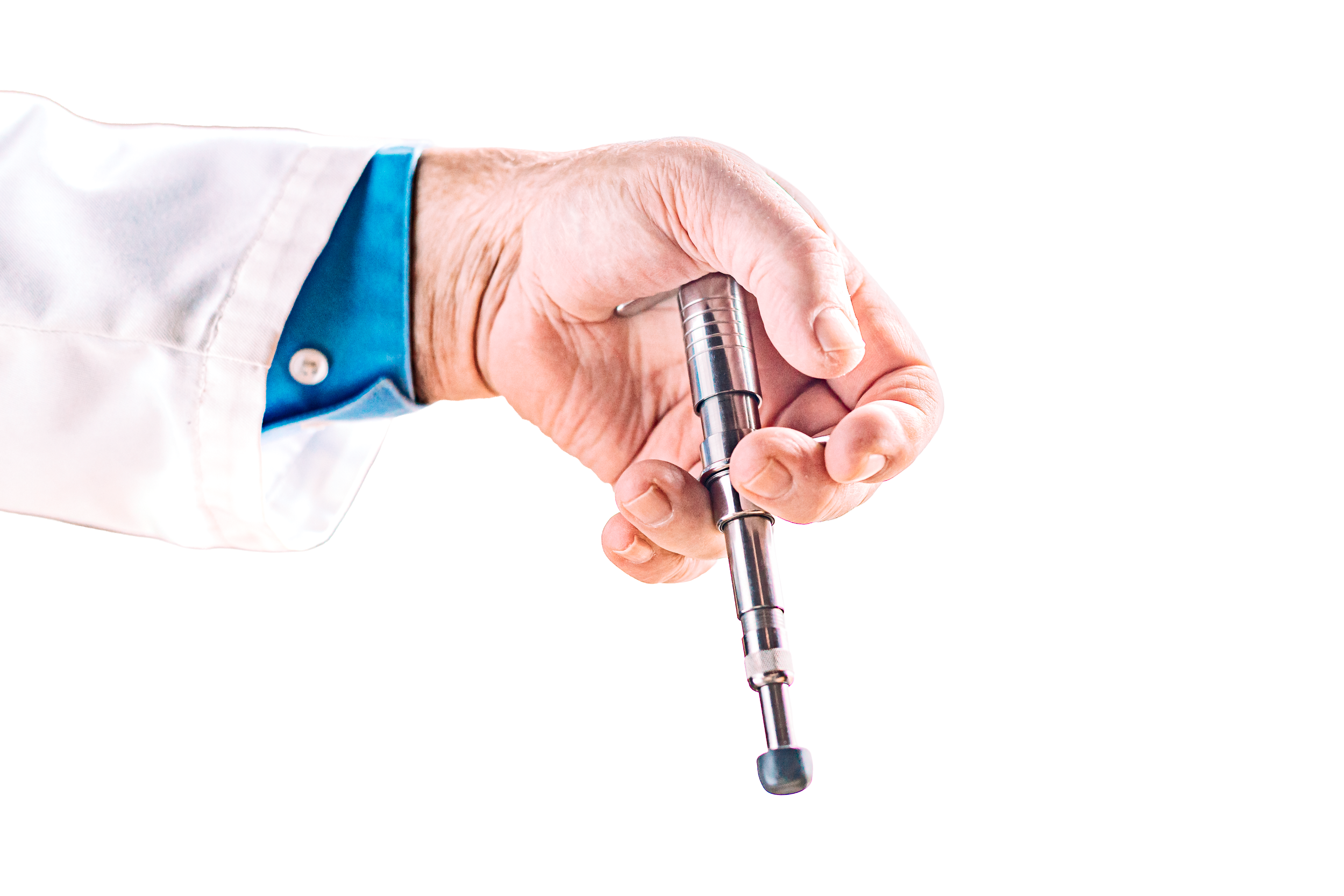 A hand holding a metal surgical instrument against a plain white background.