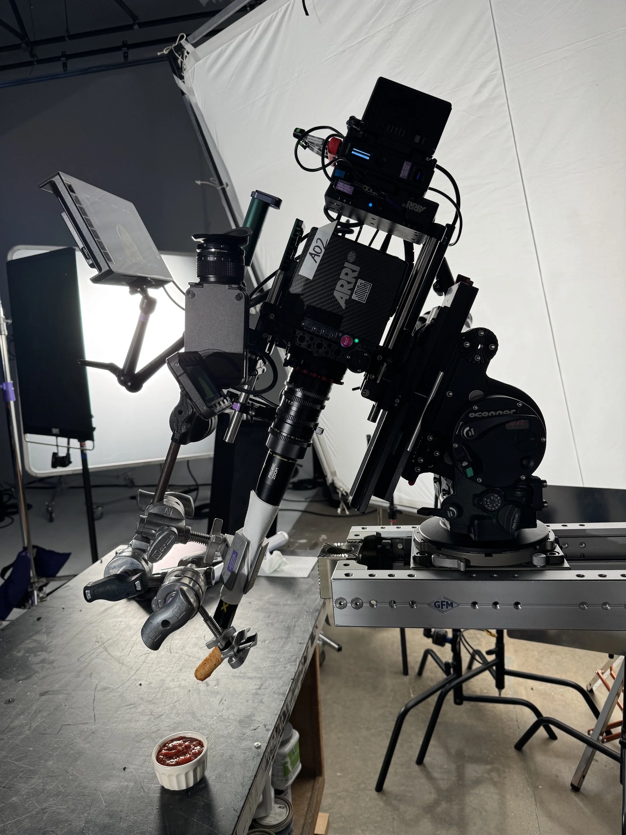 Cinema camera and motion-control rig on the Ember & Frame studio stage.