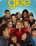 Group of diverse teenagers from the TV show Glee smiling and posing together.