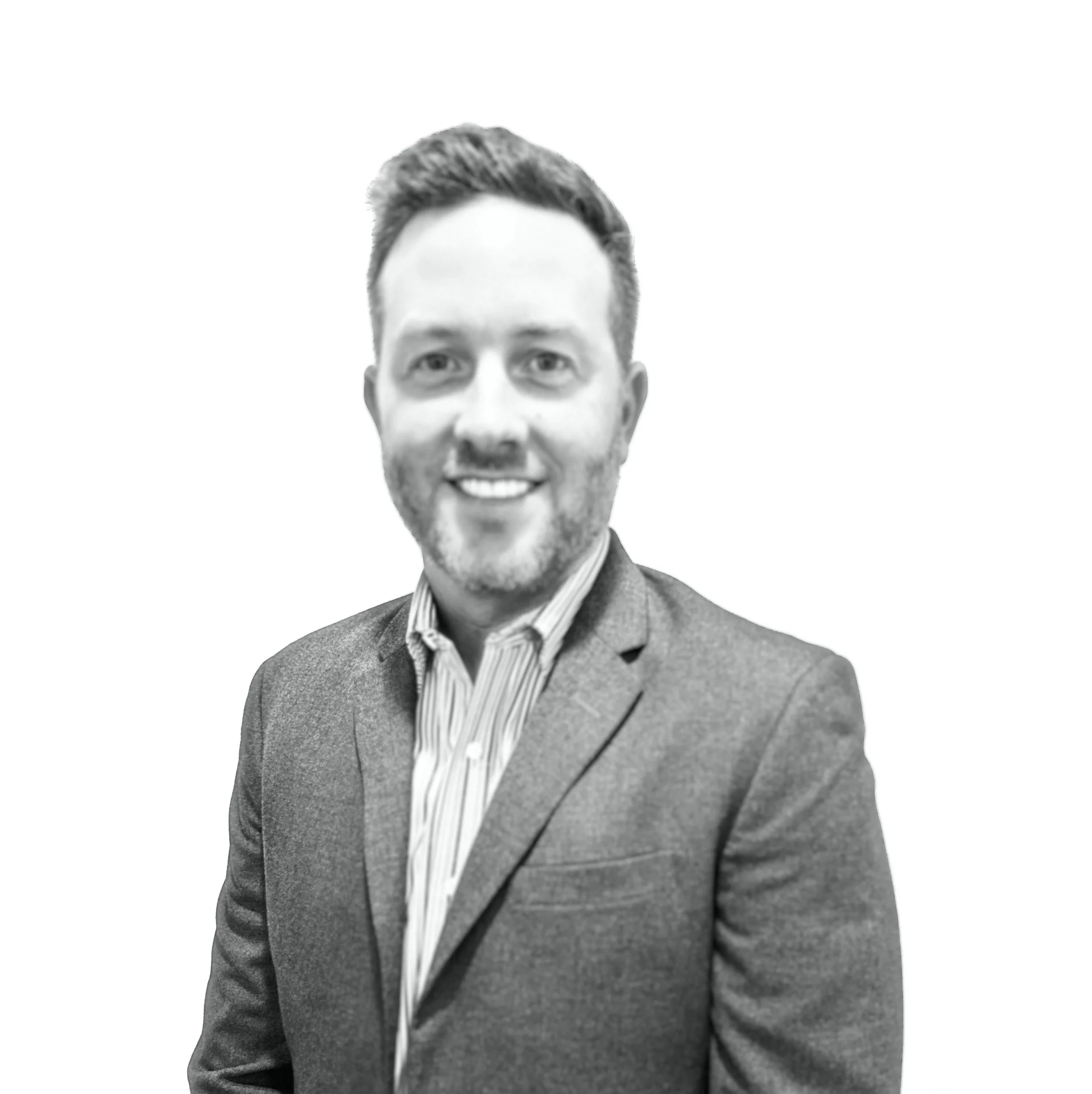 Black and white portrait of a smiling man wearing a suit and striped shirt, with a plain white background.