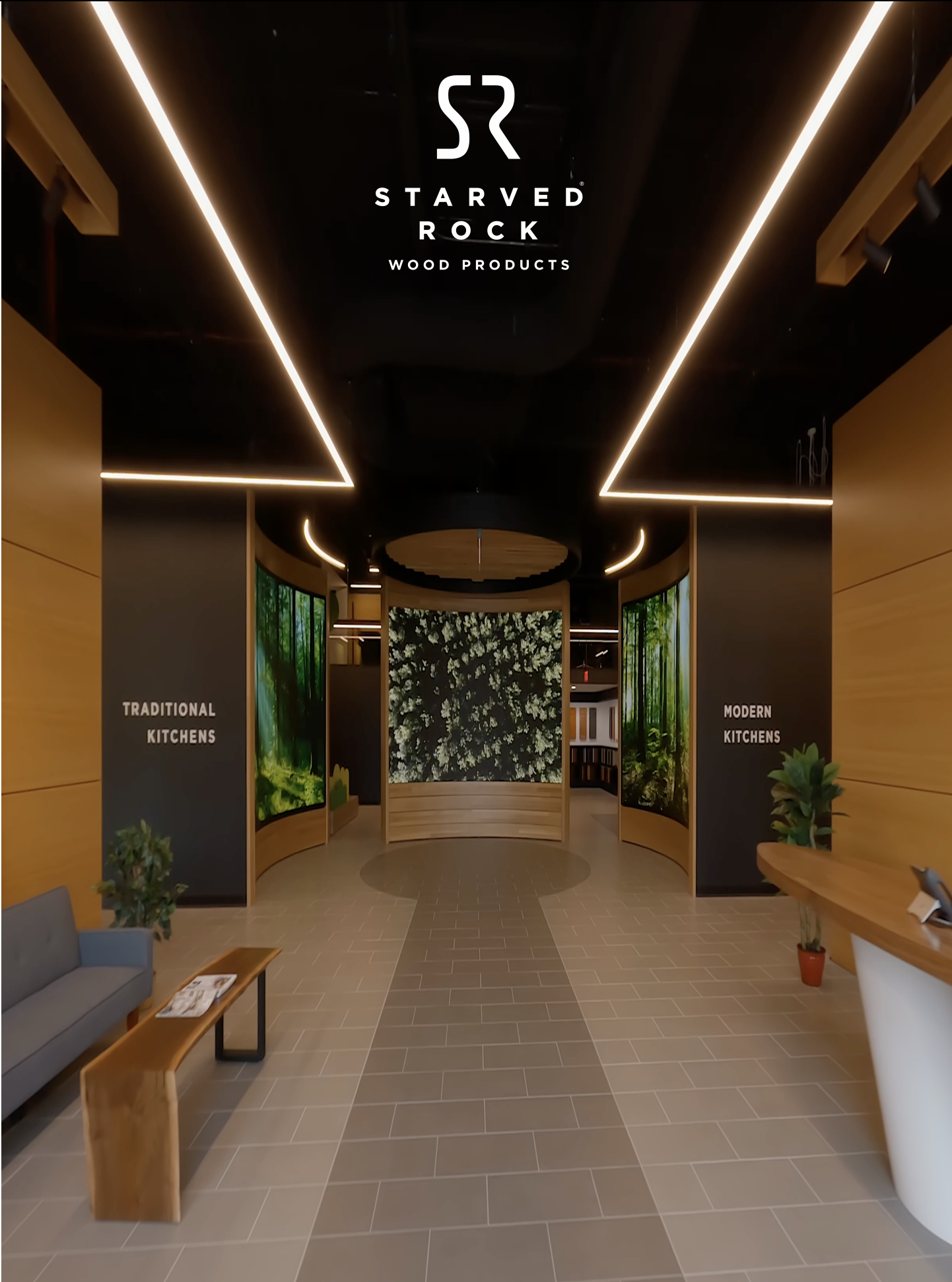 Entrance hallway showcasing the contrast between traditional and modern kitchens with signage on black panels, wood accents, indoor plants, and large digital wall displays.