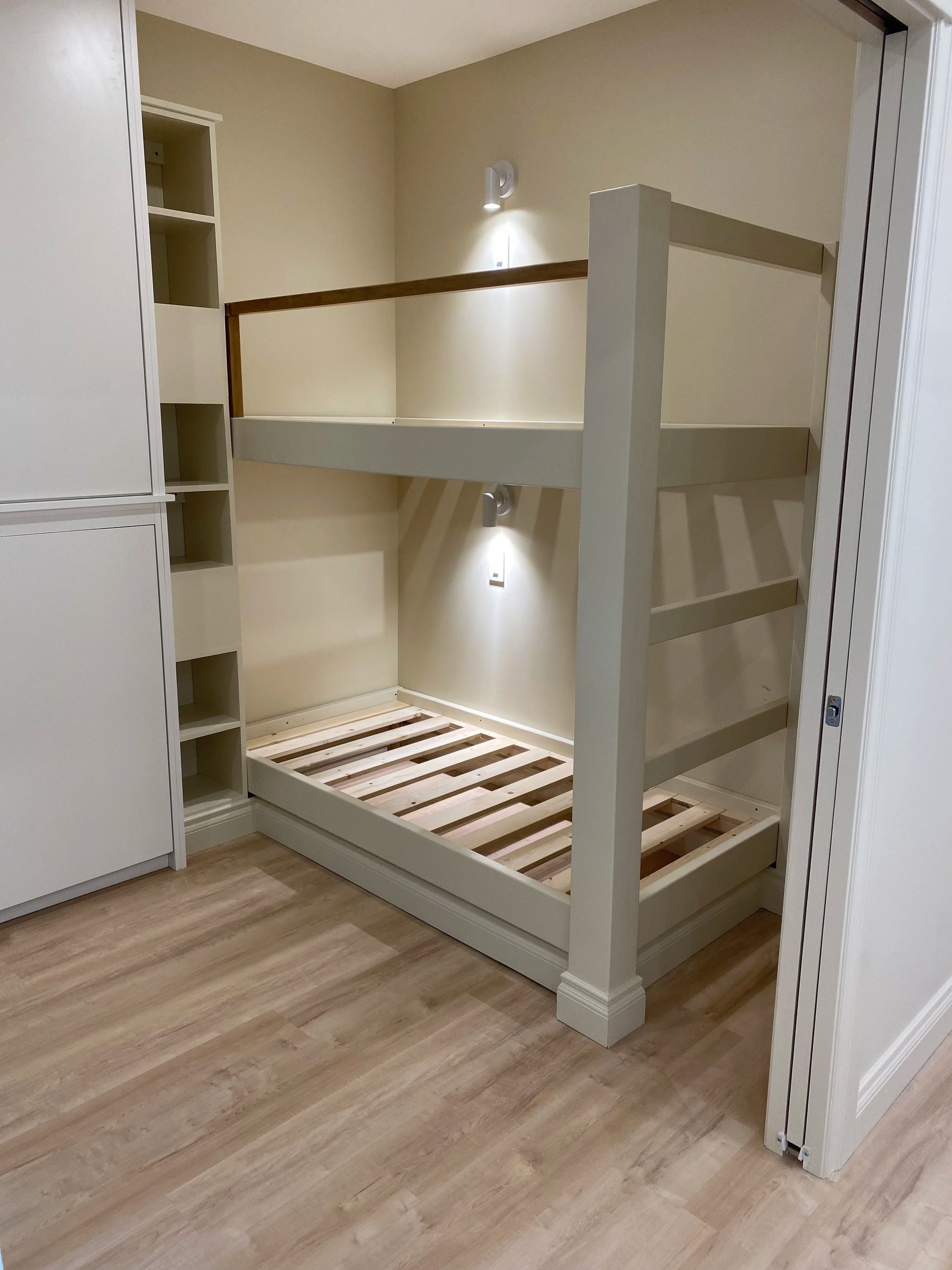Built custom bunk bed, accessible storage and cabinet doors.