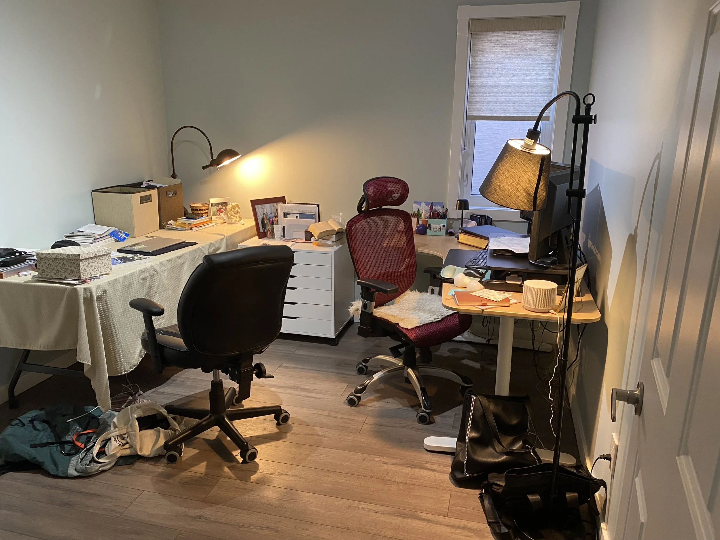 Before pic of crowded and cluttered home office.