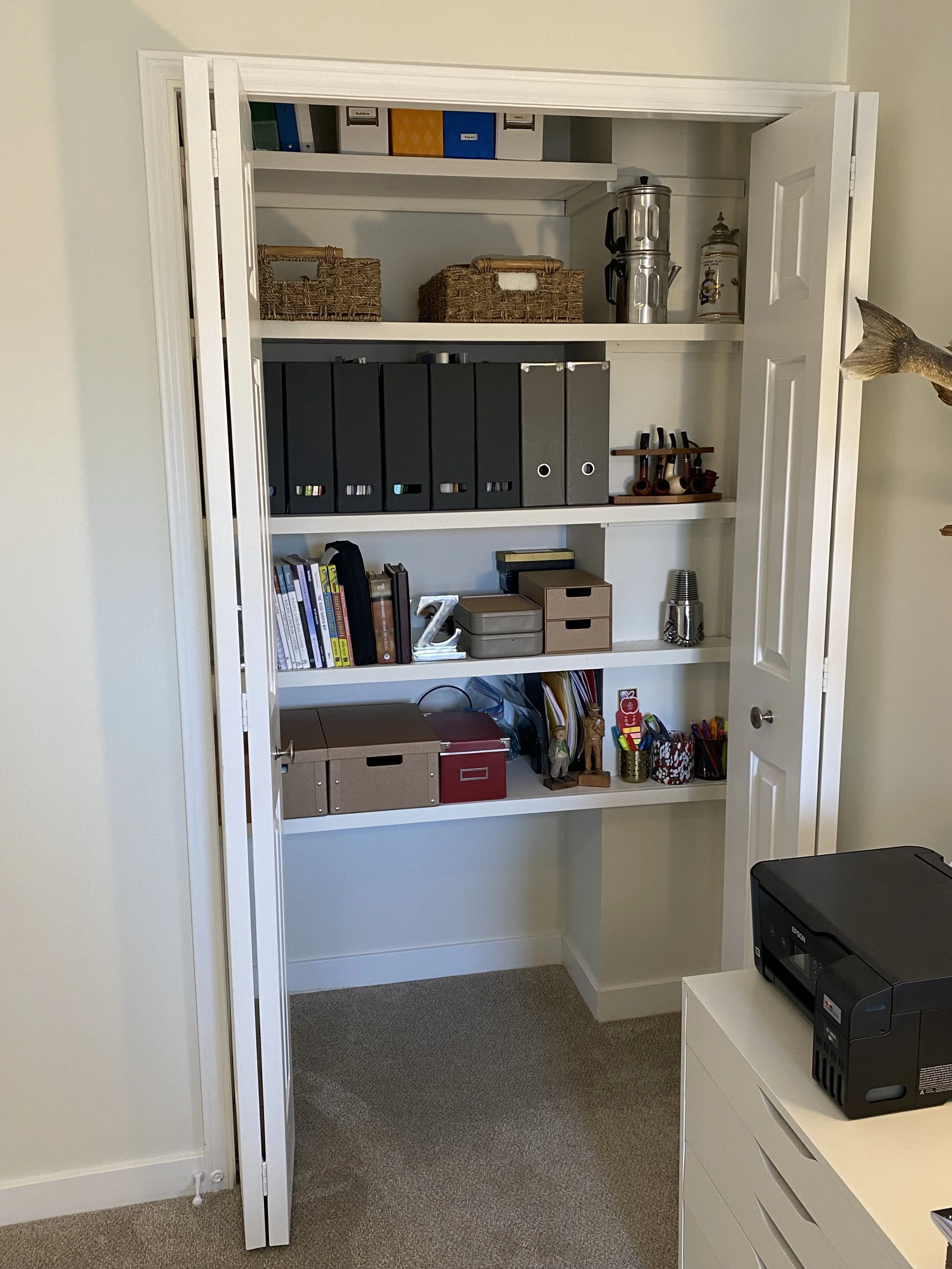 After pic of custom closet modification for easier access to essentials for efficient workflow.