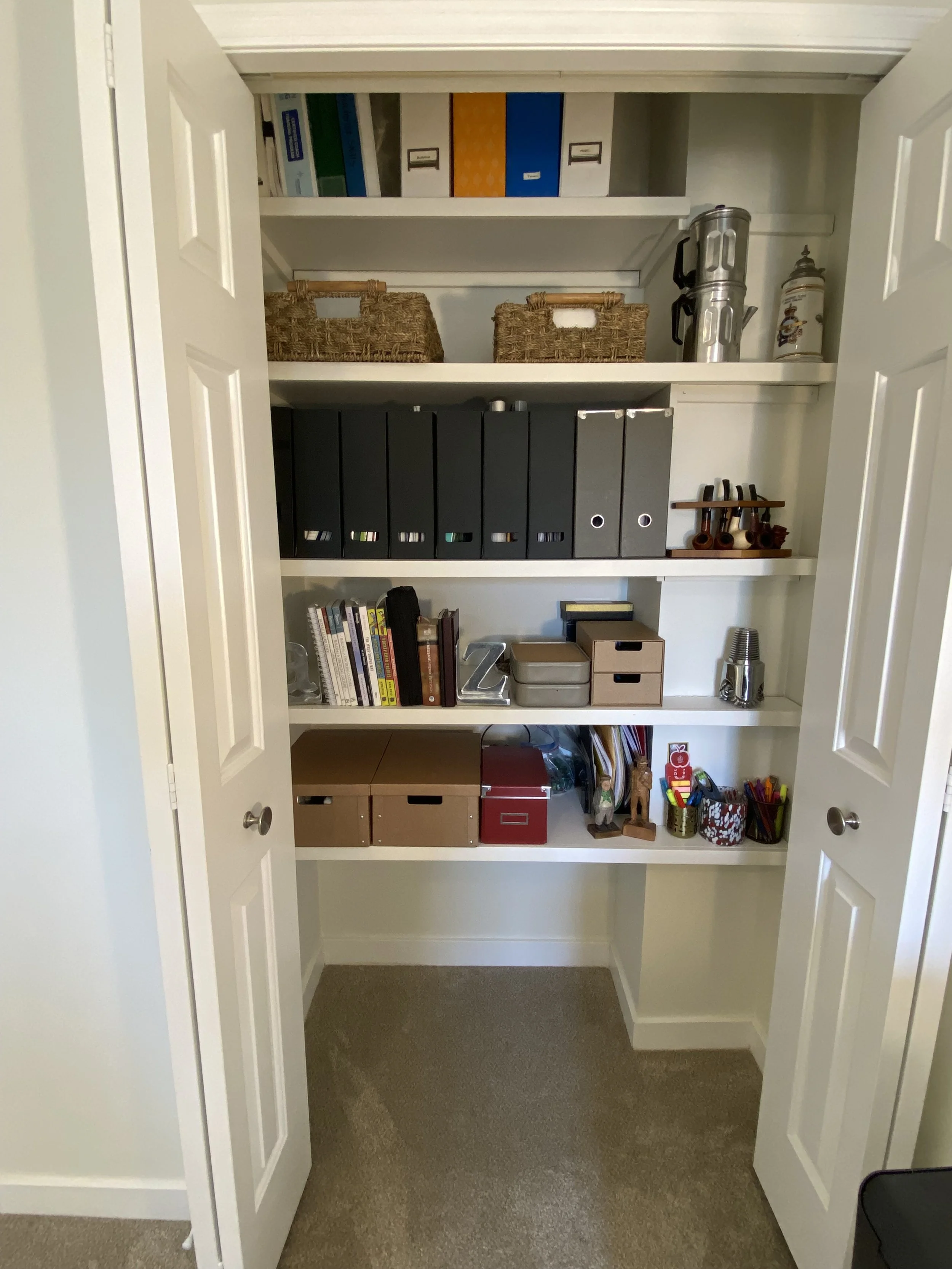 After pic of custom closet modification for easier access to essentials for efficient workflow.