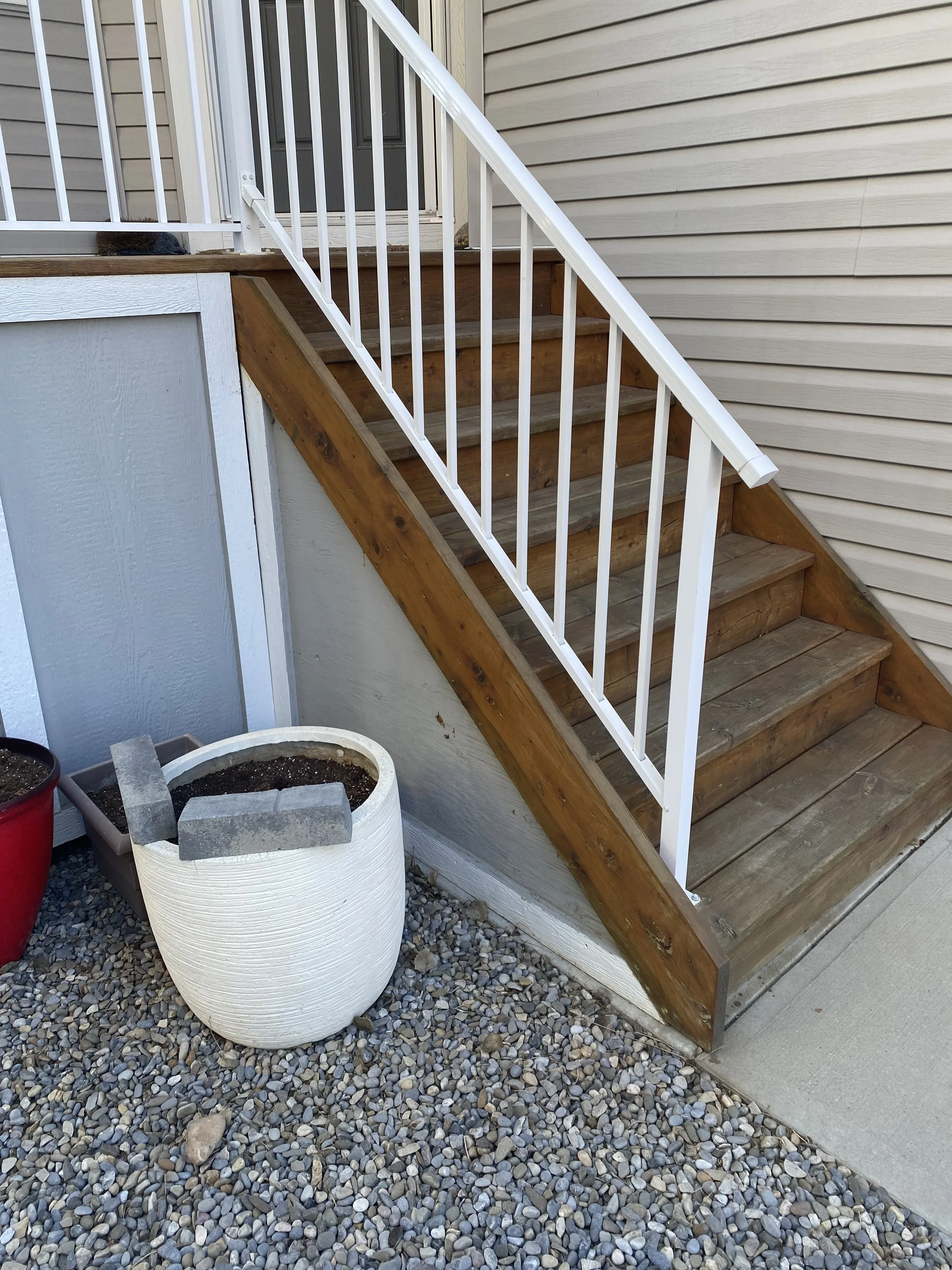 Before picture of steep front entrance stair access to home. 