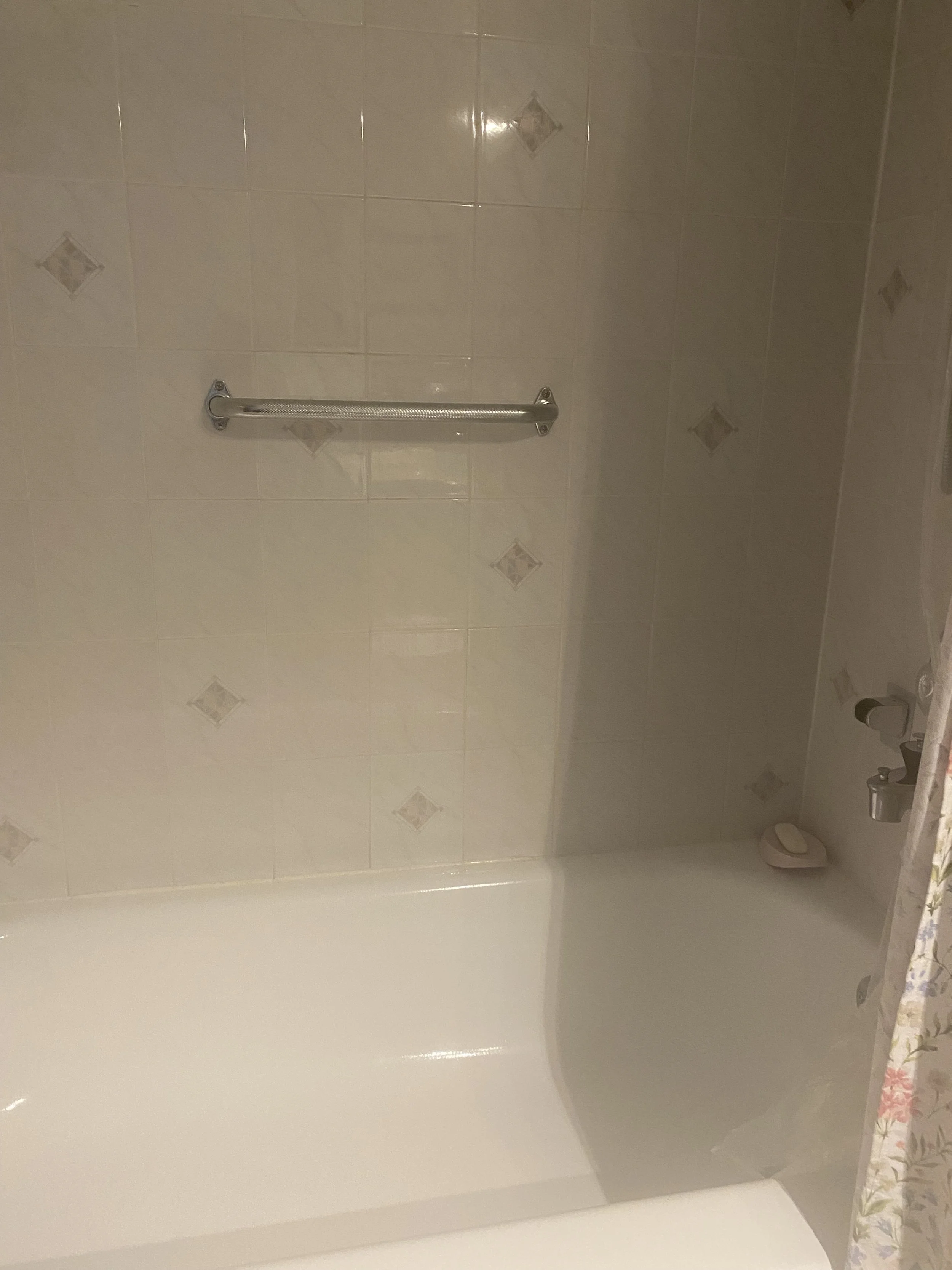 Installed vertical and horizontal grab bars in primary bathroom (tile) for client with mobility challenges.