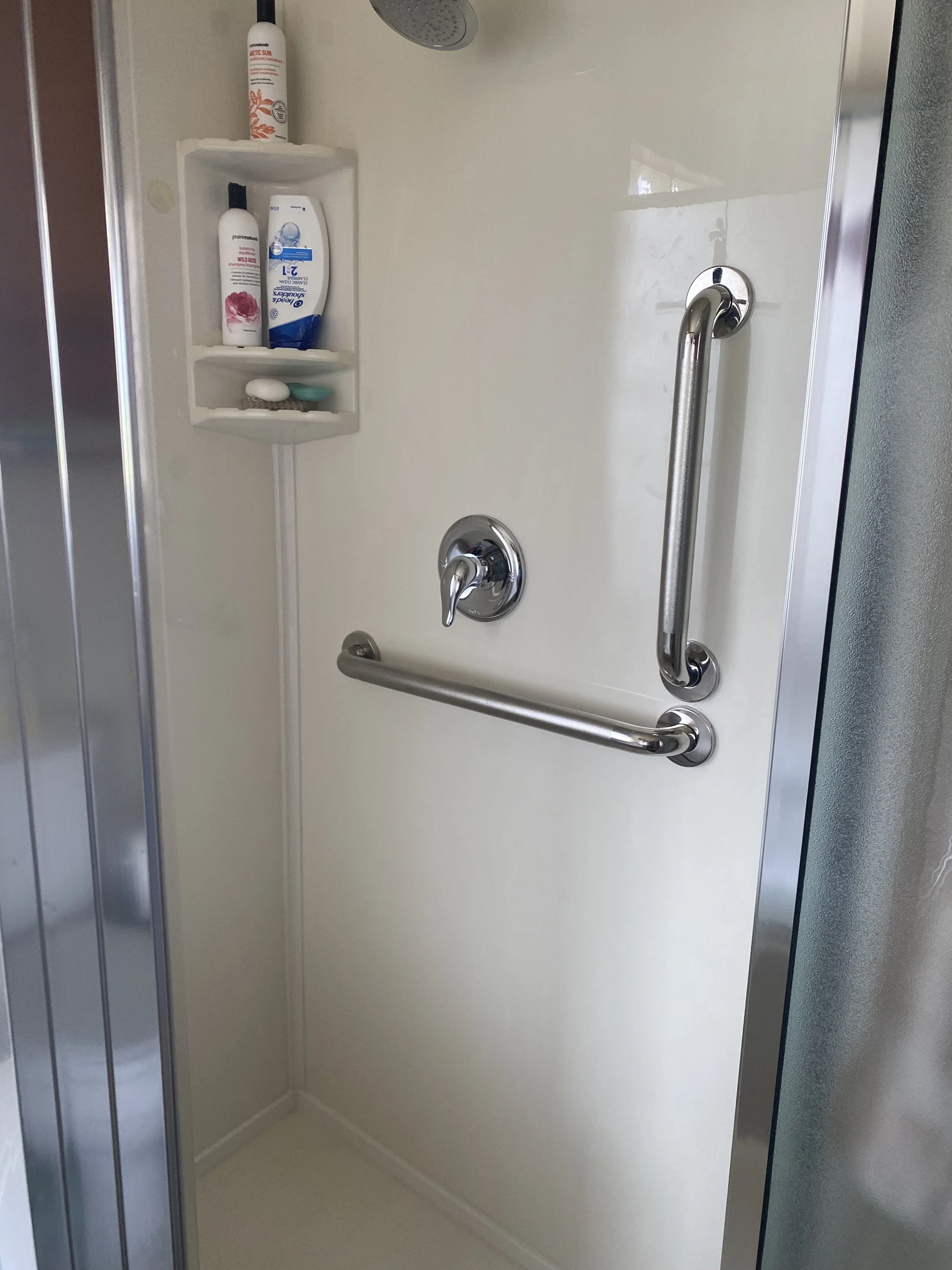 Installed grab bars in ensuite shower and near toilet for client with mobility challenges.