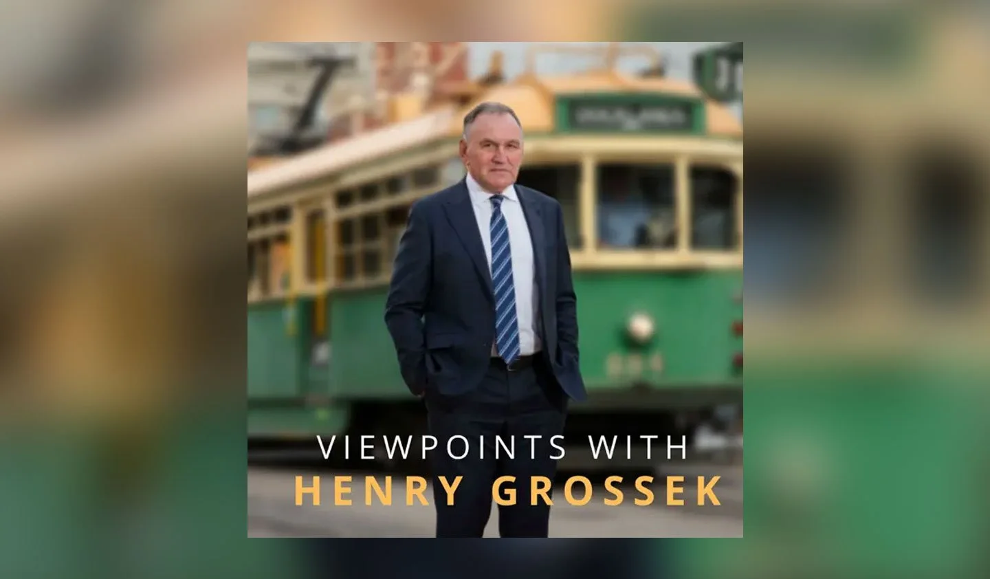 A man in a suit and tie standing in front of a vintage trolley car. The text on the image reads 'Viewpoints with Henry Grossek'.