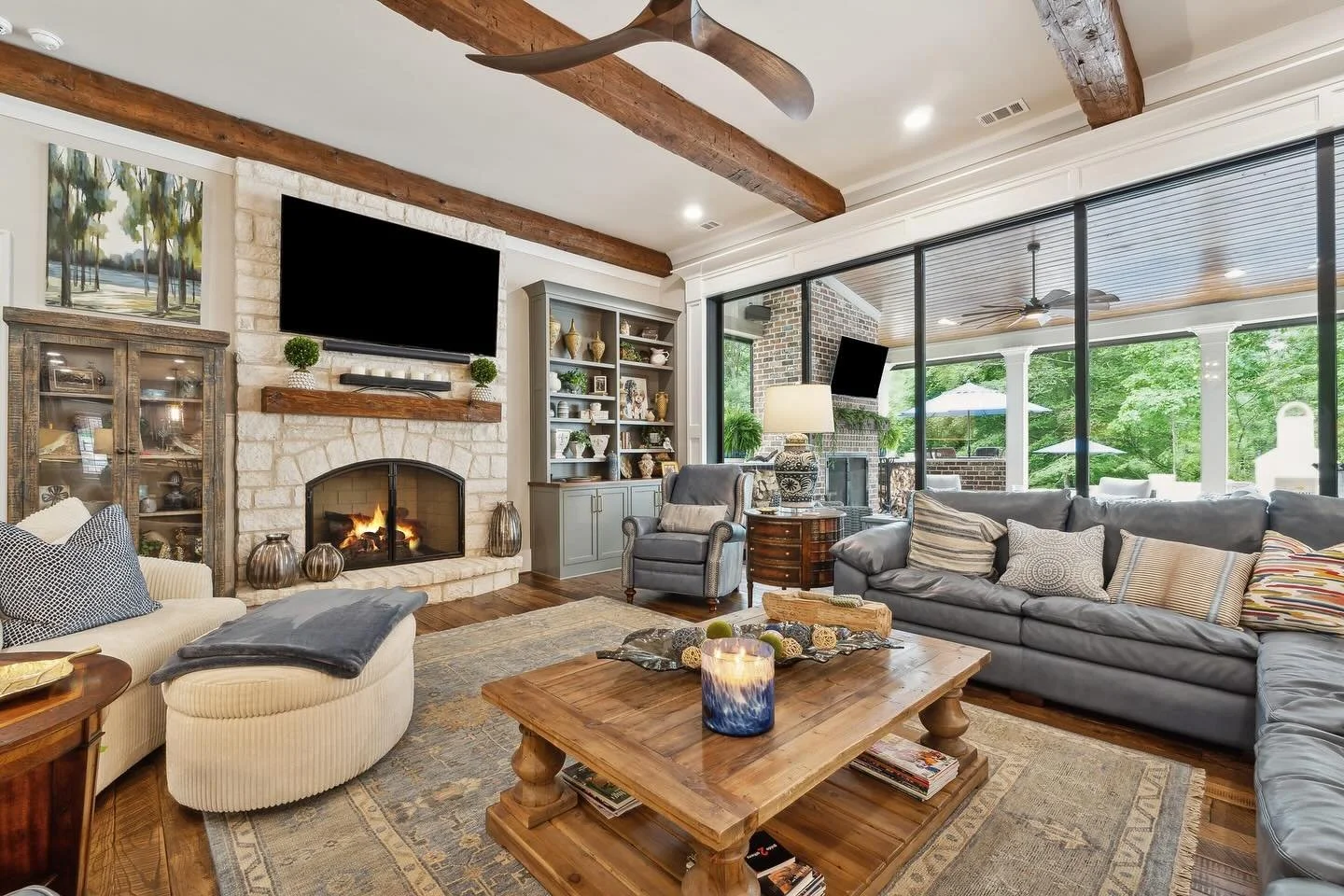Loving this Texas limestone fireplace with the reclaimed wood beams and floors!