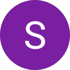 A purple circle with a white letter S in the center