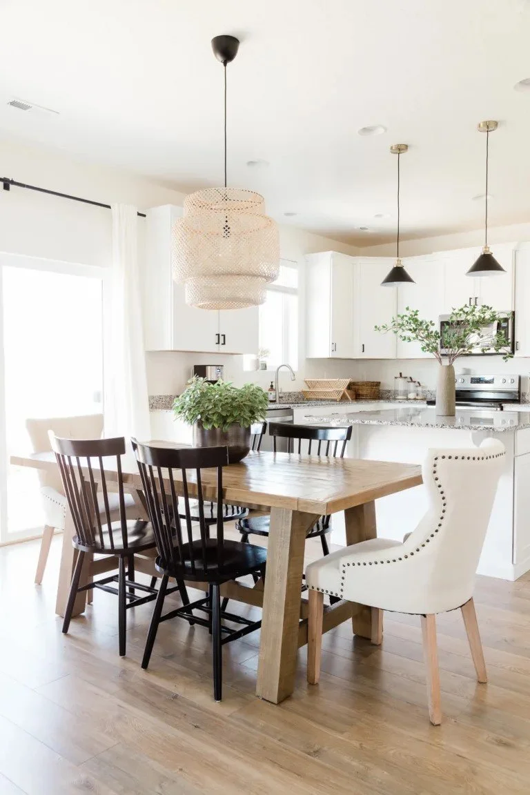 bright warm kitchen with white cabinets and warm wood finishes