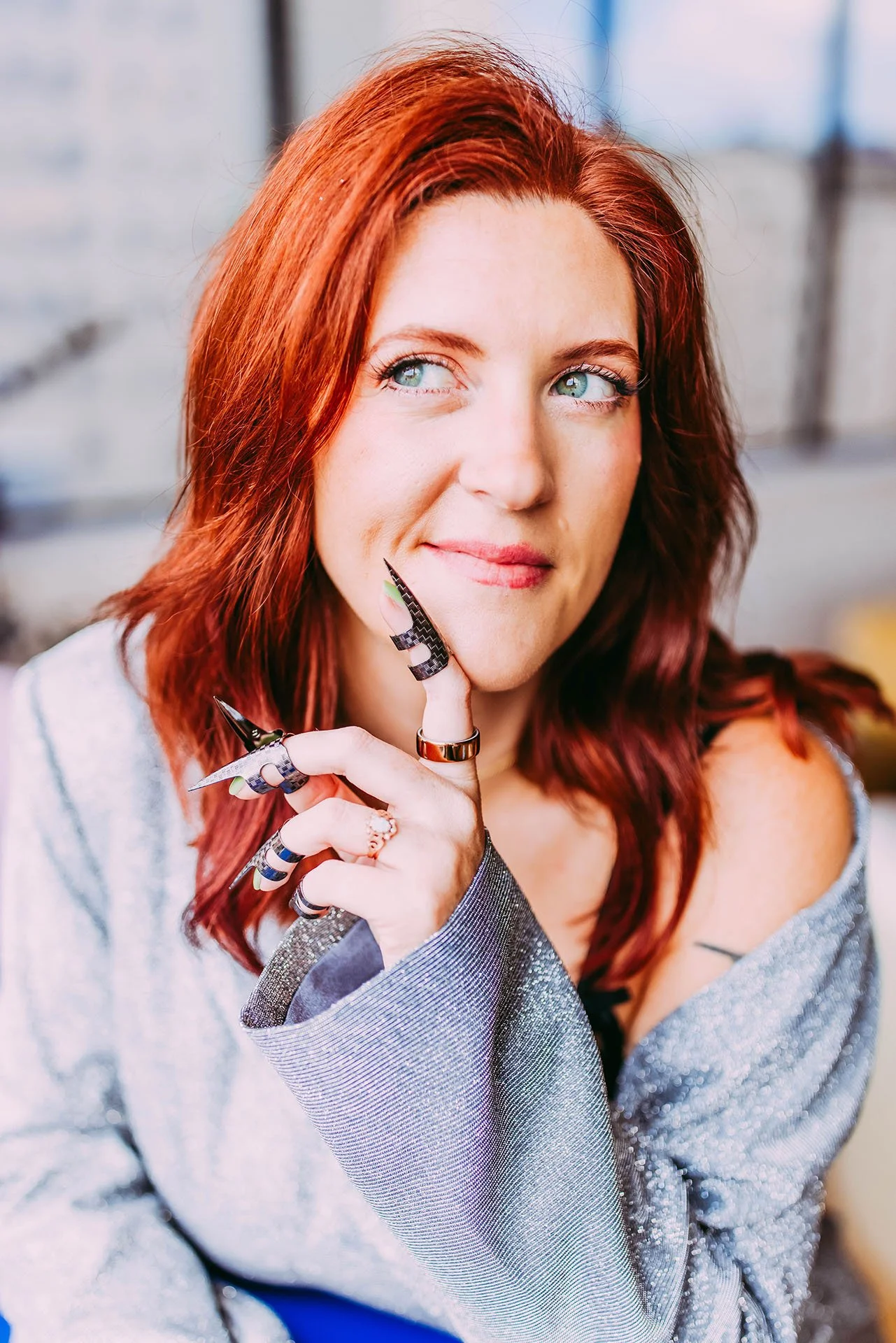 The Sex Copywriter, Athena Gayle portrait of her looking seductively to the side with finger claws attached