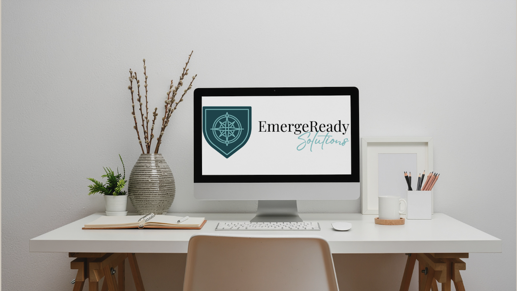 EmergeReady desktop image - Computer monitor displaying the EmergeReady Solutions logo in a professional workspace.