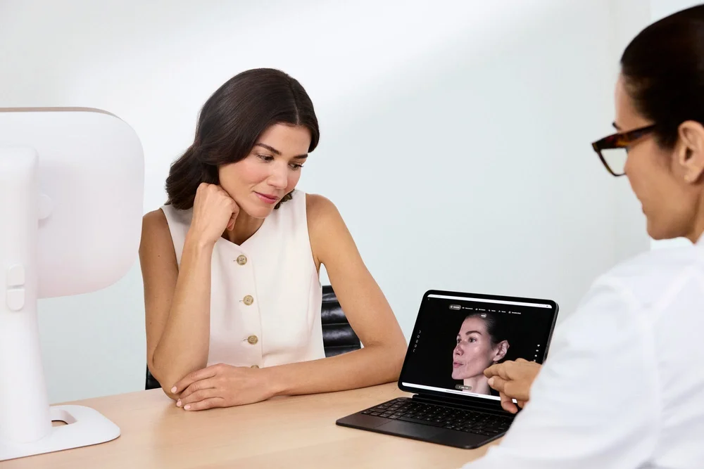 Reviewing Aura 3D skin analysis results with a client