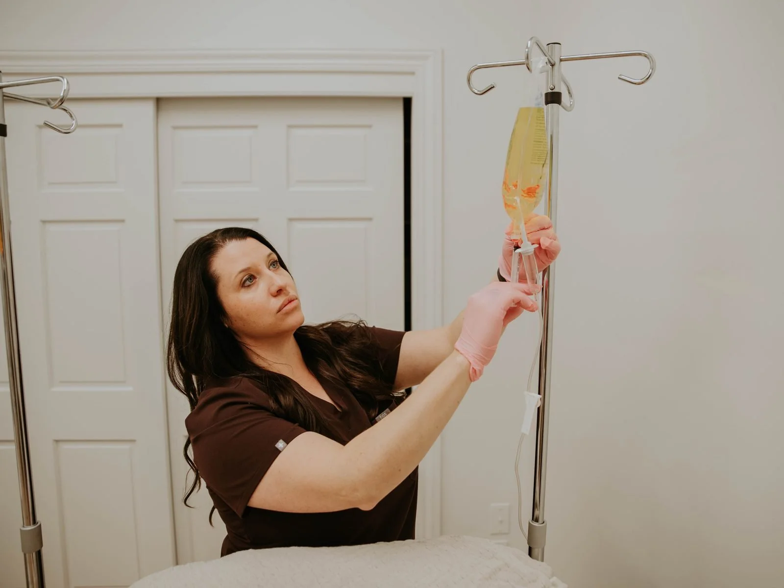 Atlas clinical team member preparing an IV drip