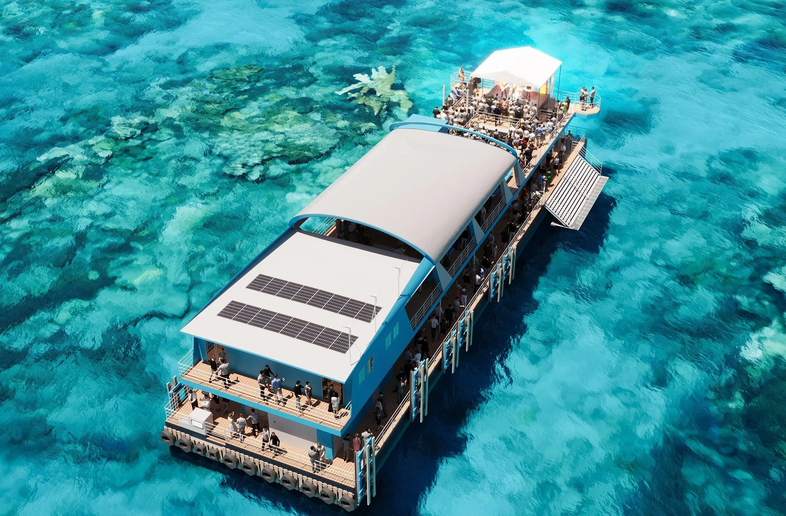Aerial view of a large floating platform with solar panels and a covered shelter, surrounded by clear blue water, with many people on board.