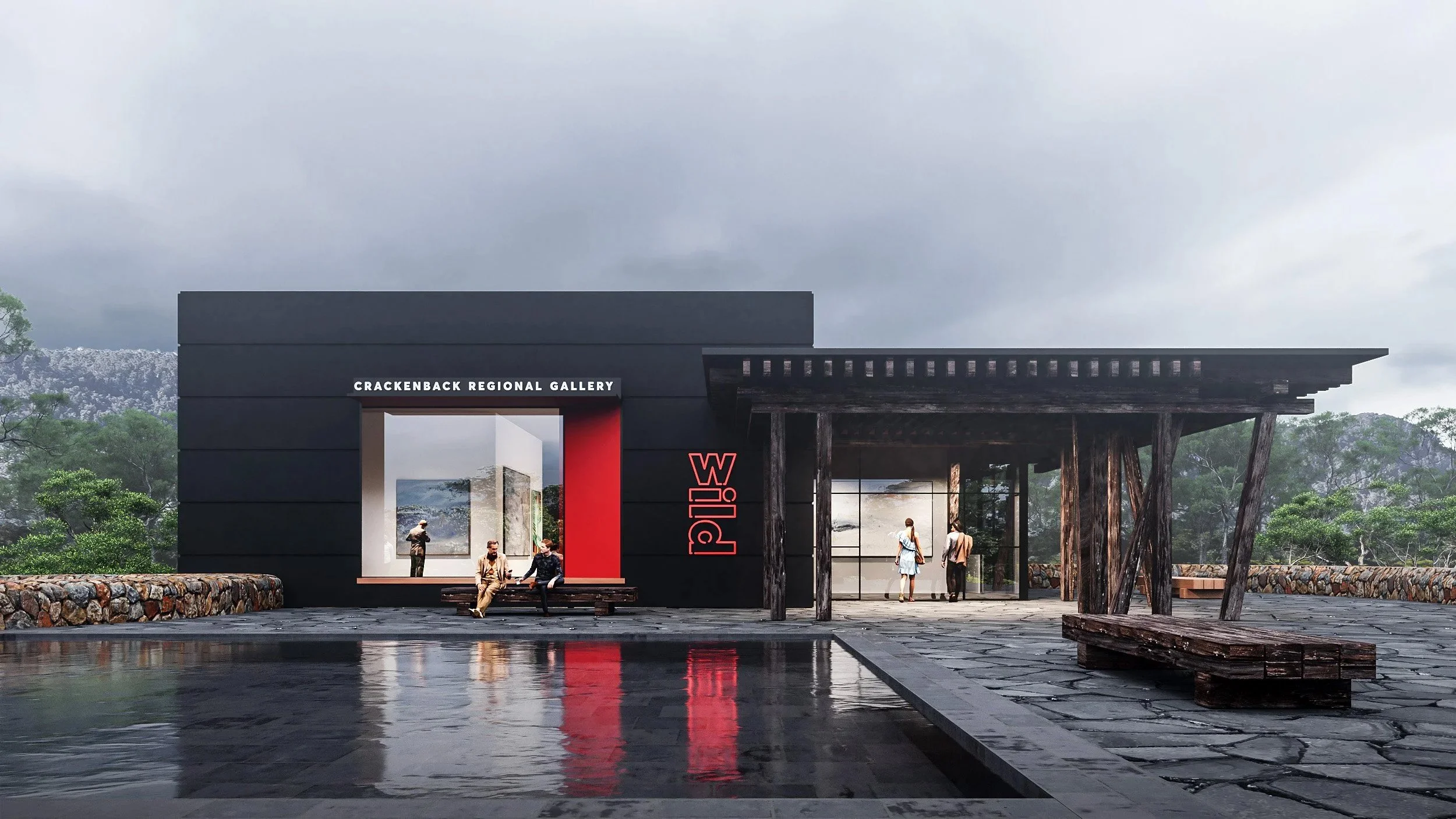 Modern building with black and red exterior, signage for Crackenback Regional Gallery and W ild, situated in a scenic outdoor setting with trees and mountains in the background, featuring a reflective pool and wooden benches.