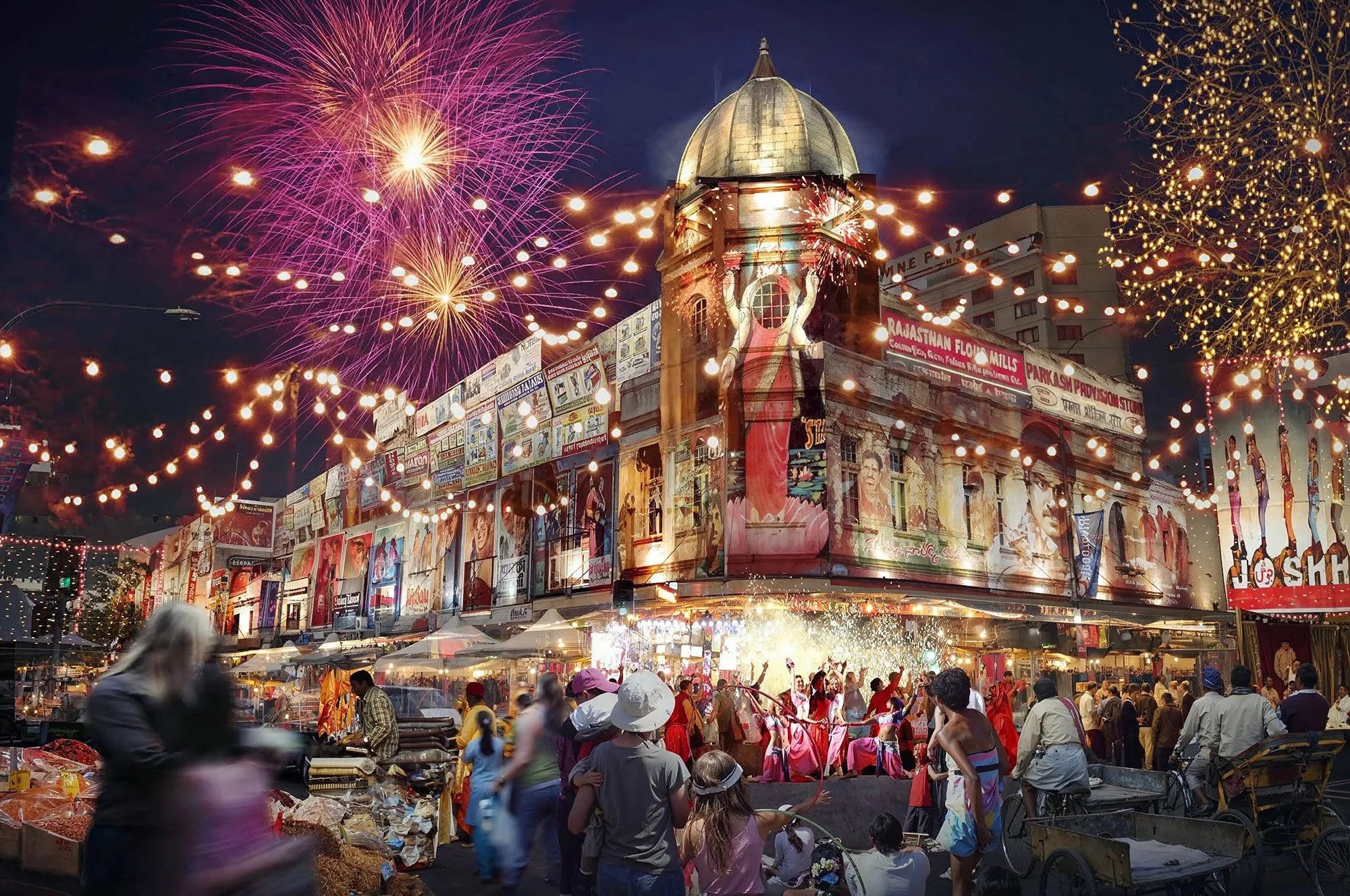 Celebration with fireworks, string lights, and a crowd of people gathered around a decorated building at night