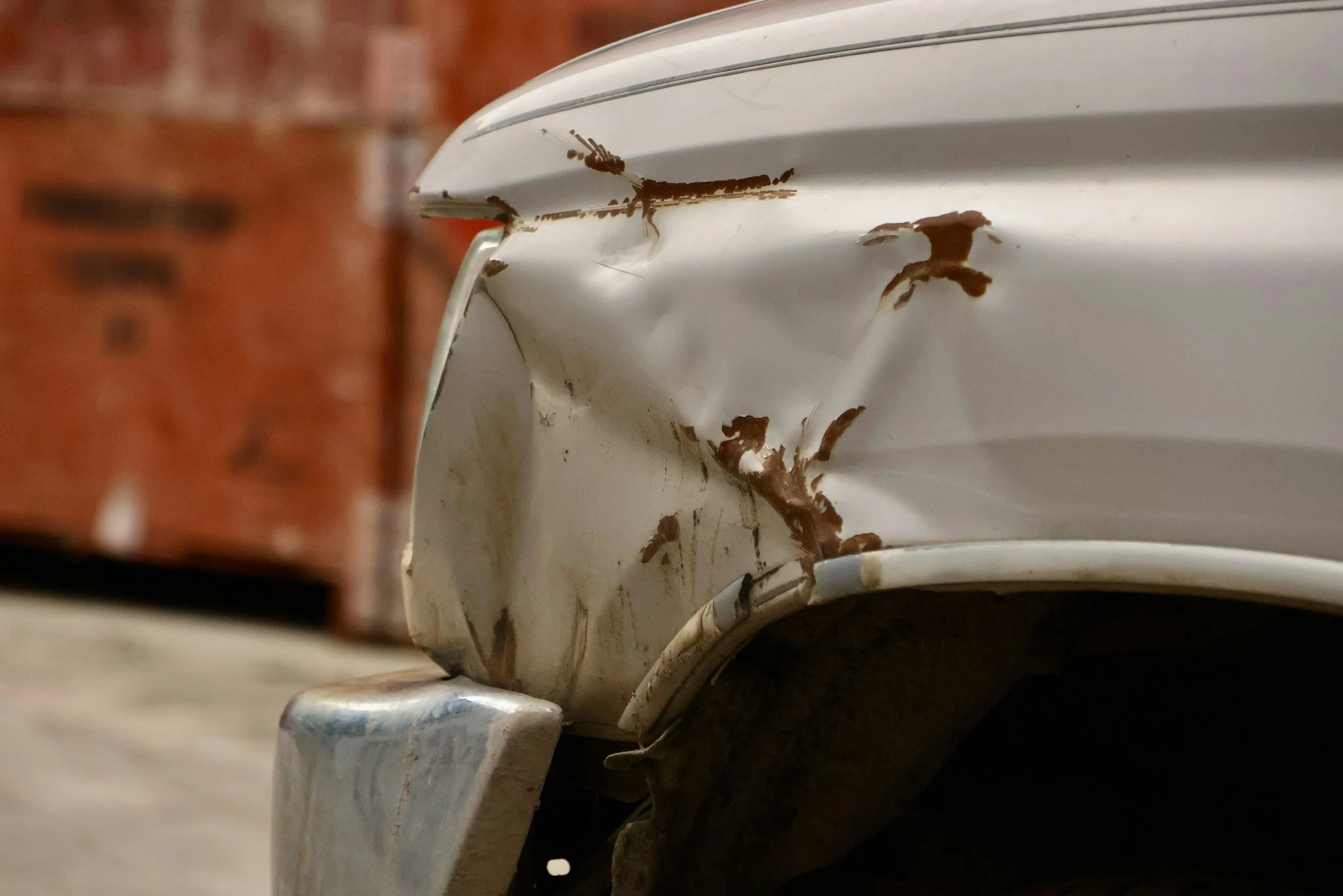 Dented front fender after a minor car accident