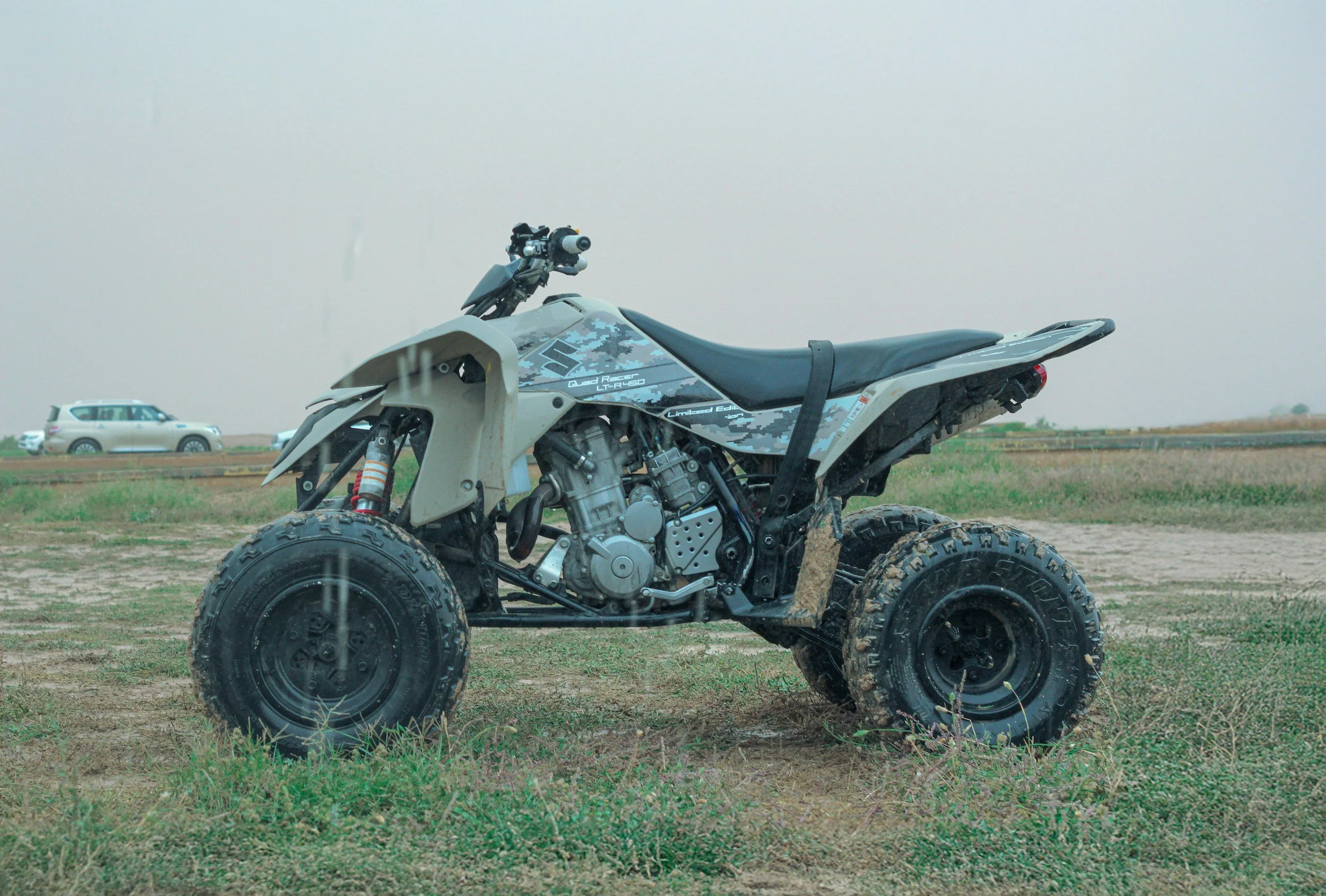 All-terrain vehicle parked on a grassy field
