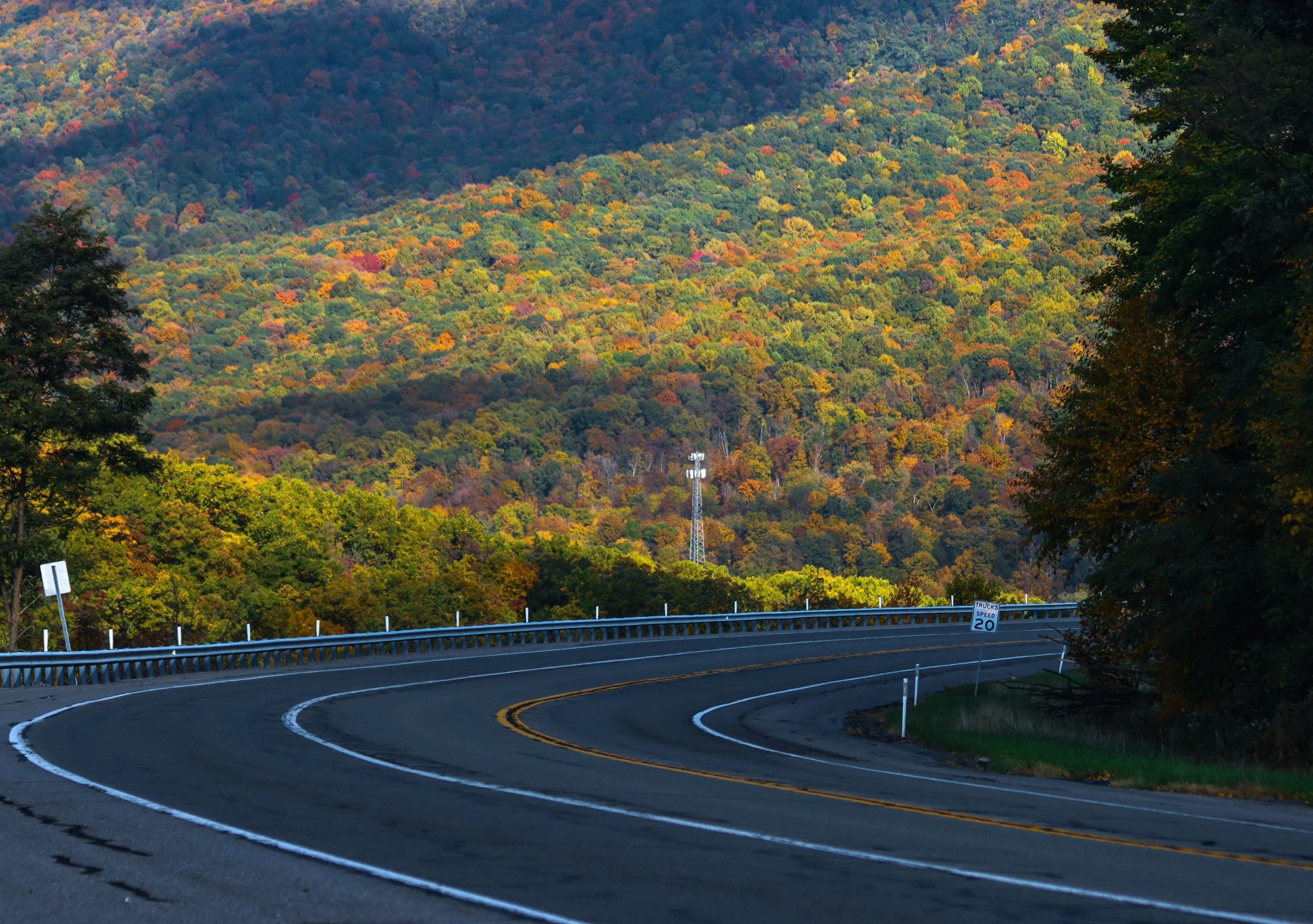 Curving highway through autumn-colored mountains in Pennsylvania