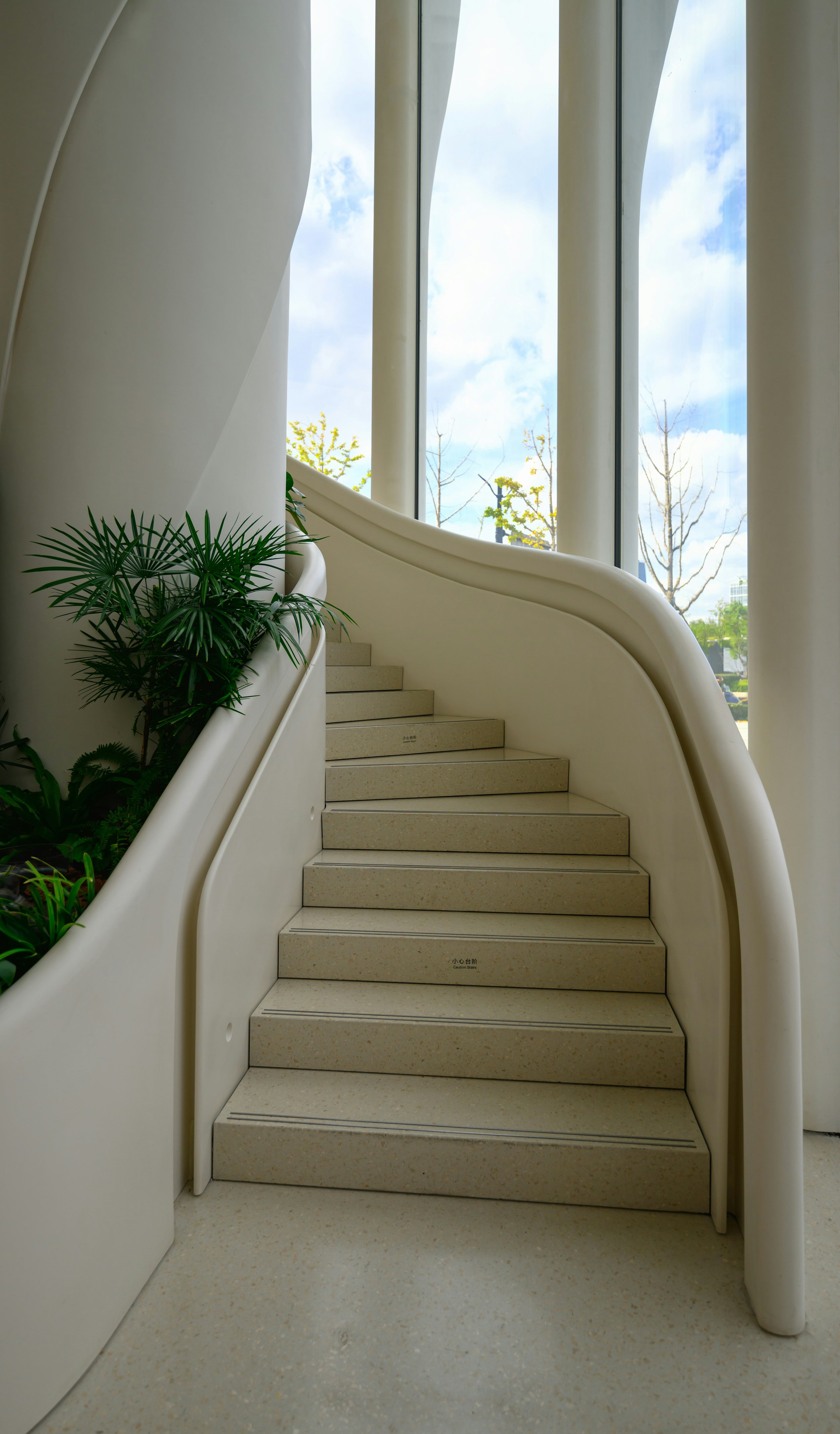 Light-filled interior staircase representing guidance, progress and confident steps in the home loan journey.