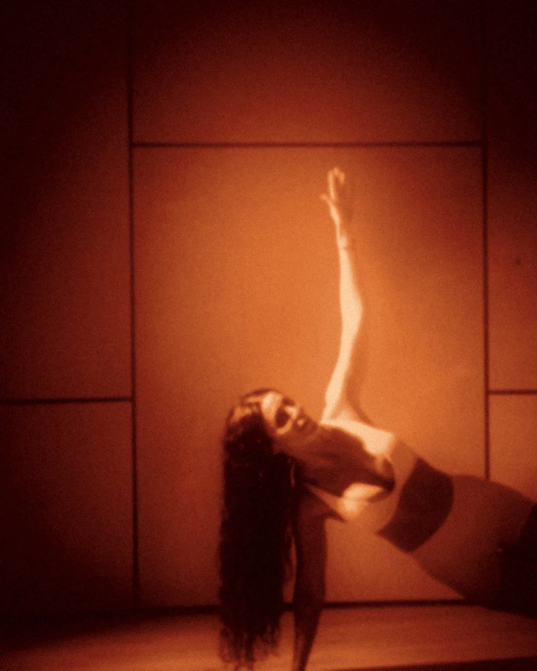 Flow Sculpt: a reaching side stretch in amber light