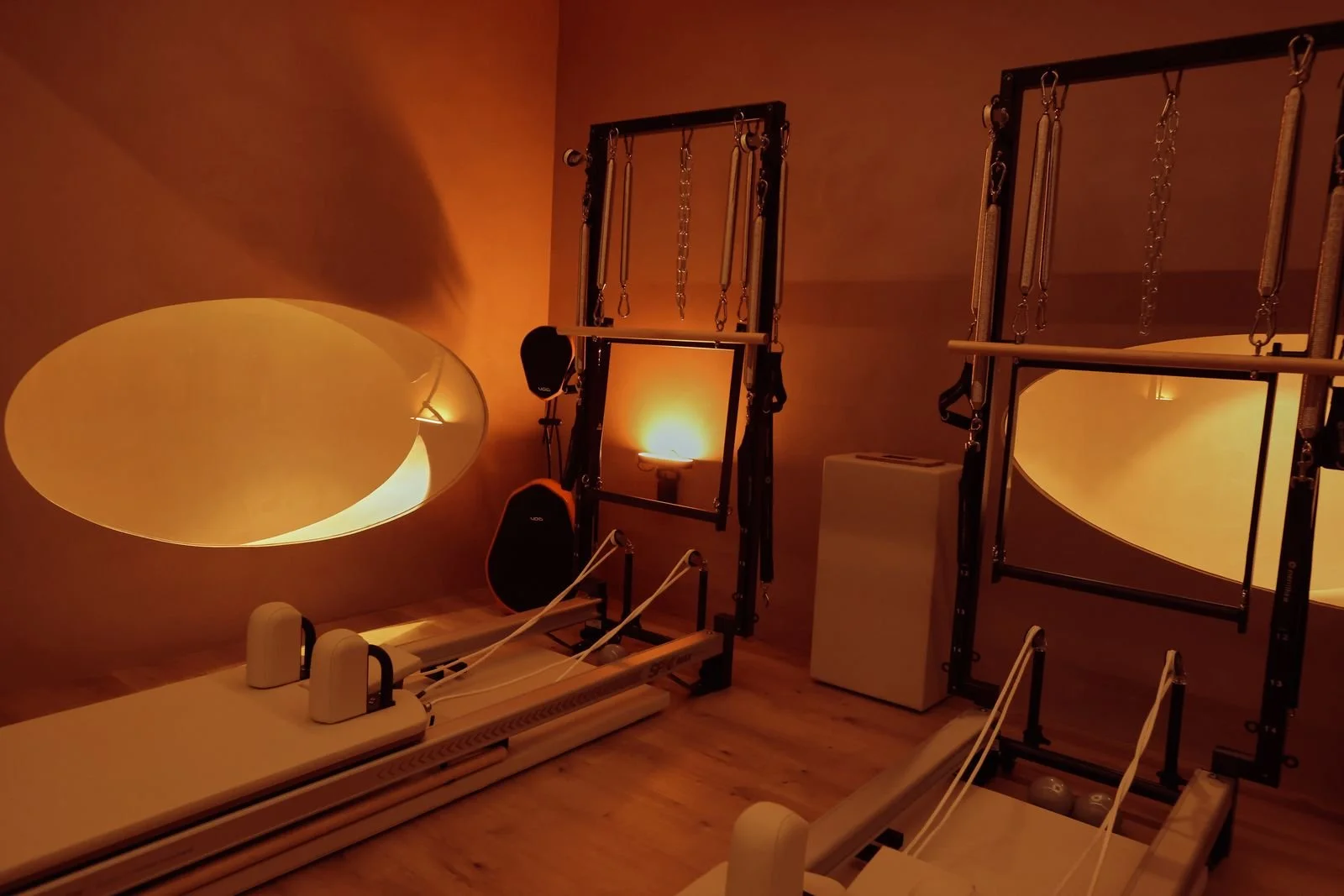 The Santa Monica reformer room, lit through its oval window