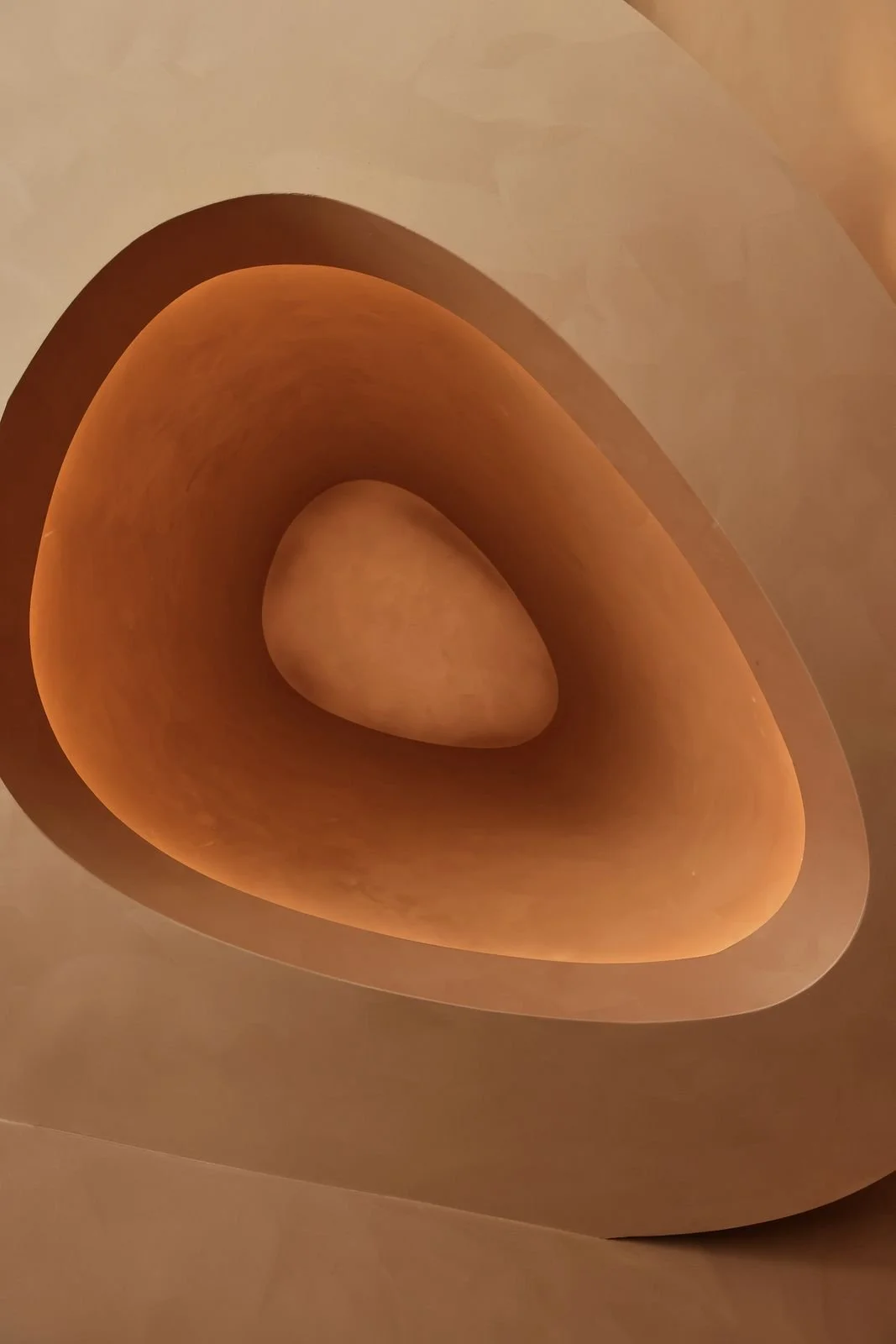 A sculpted oval ceiling with hidden warm light