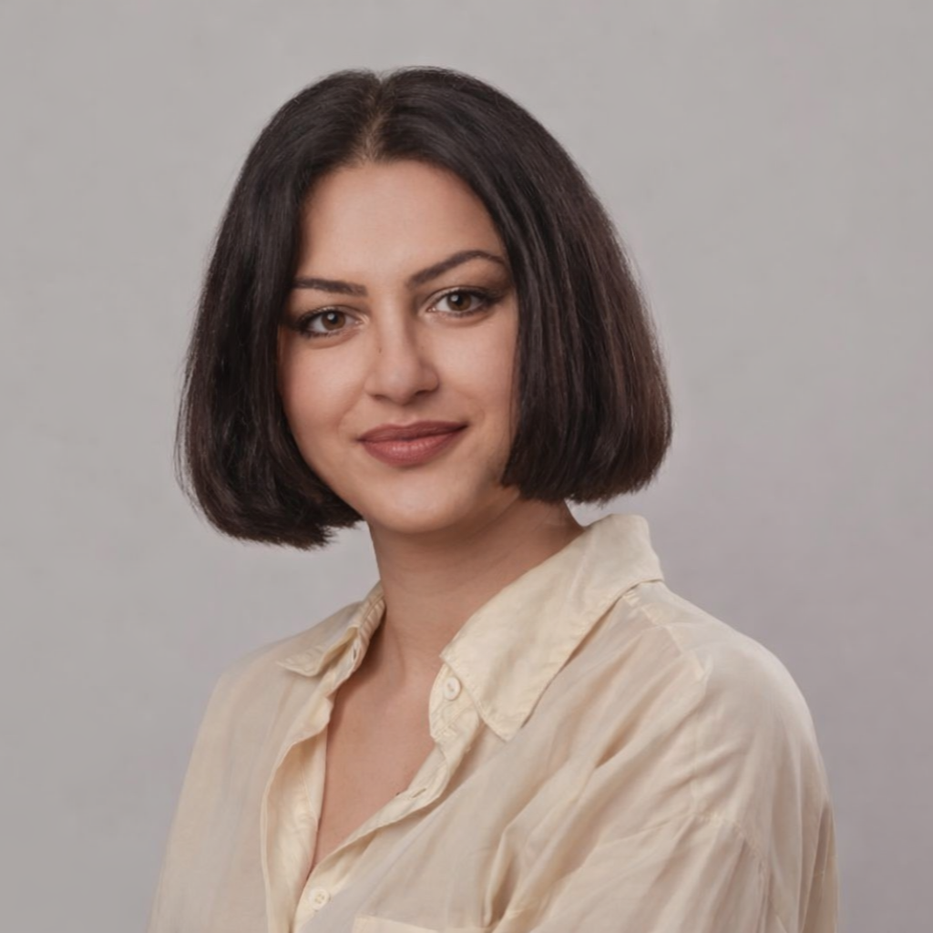 Portrait of Anna Dobrisan, an Integrative Psychotherapist, smiling gently at the camera, wearing a neutral top, conveying warmth, approachability, and professionalism