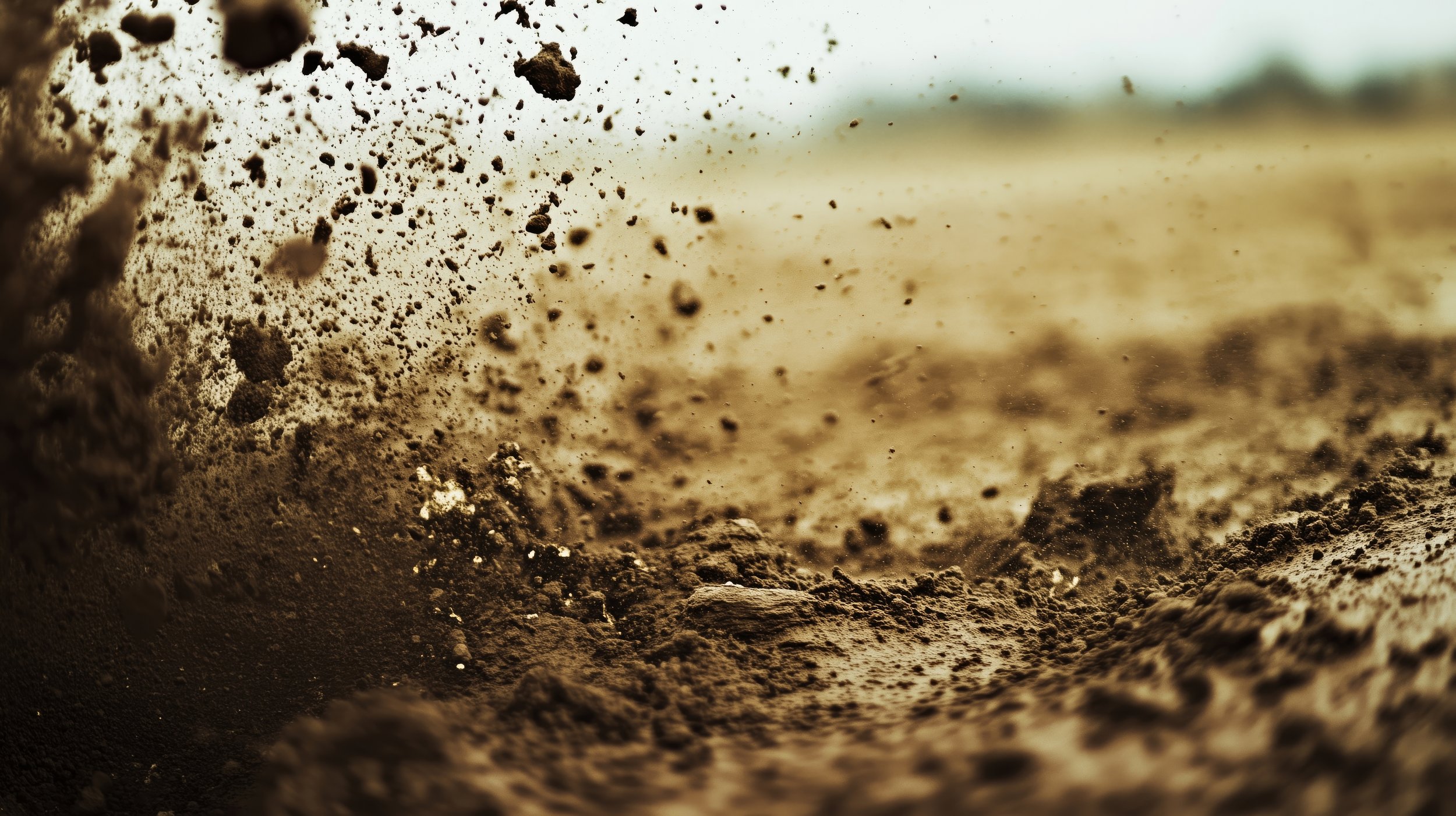 intense-close-up-dust-erupting-from-dry-soil.jpg