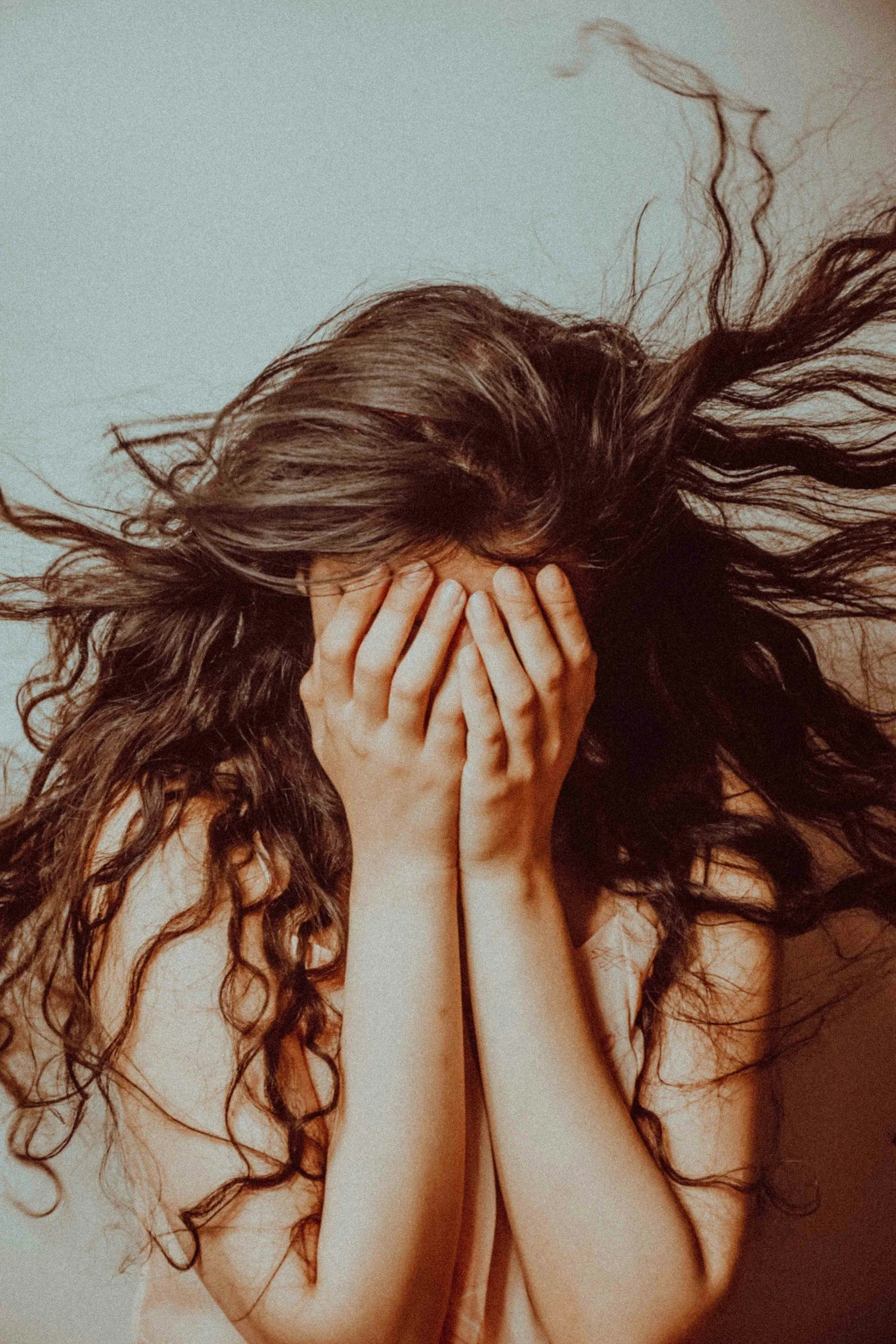 Woman feeling emotionally overwhelmed during an intense emotional reaction