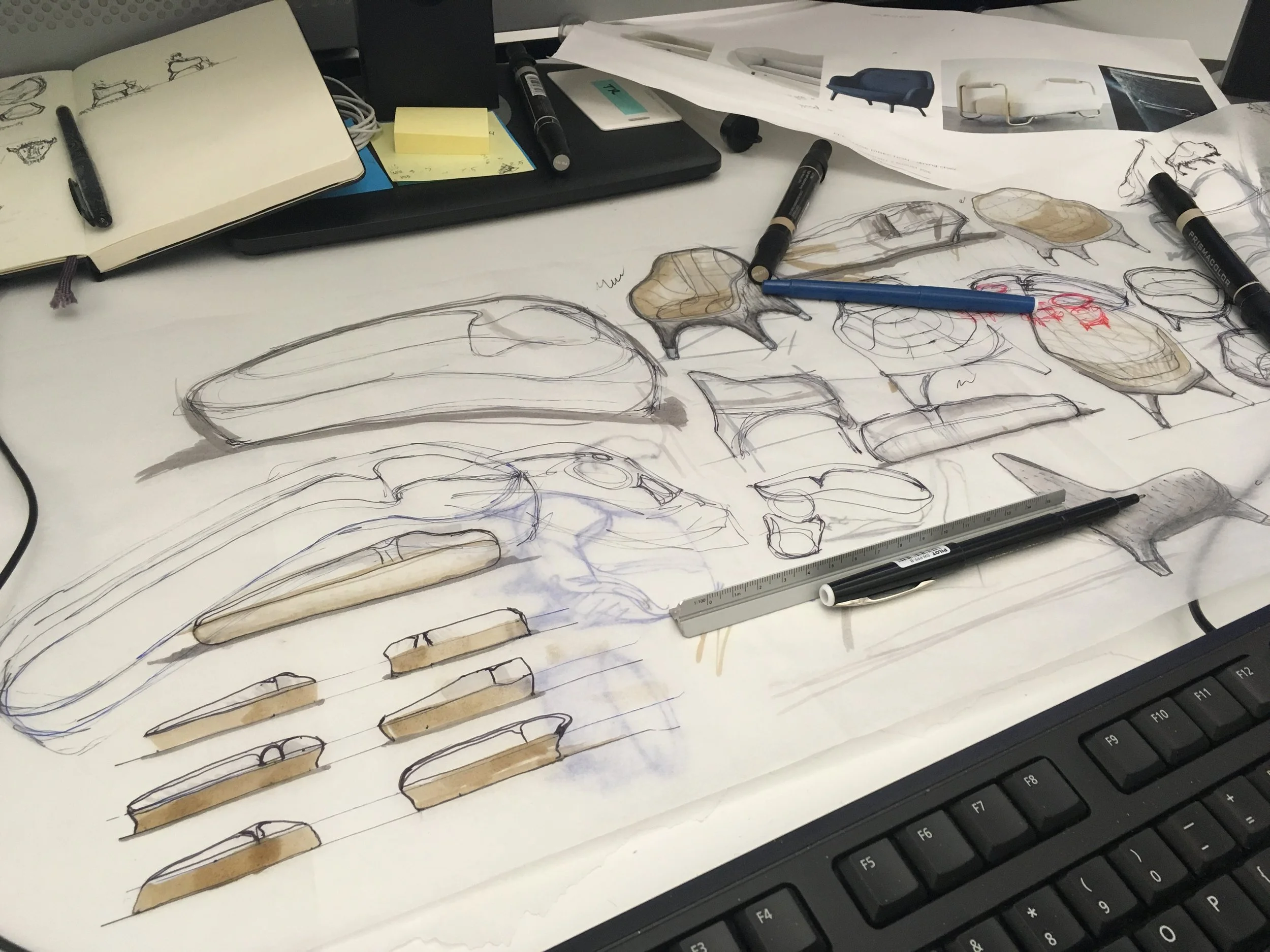 a sketch page full of designs for sofa and armchairs